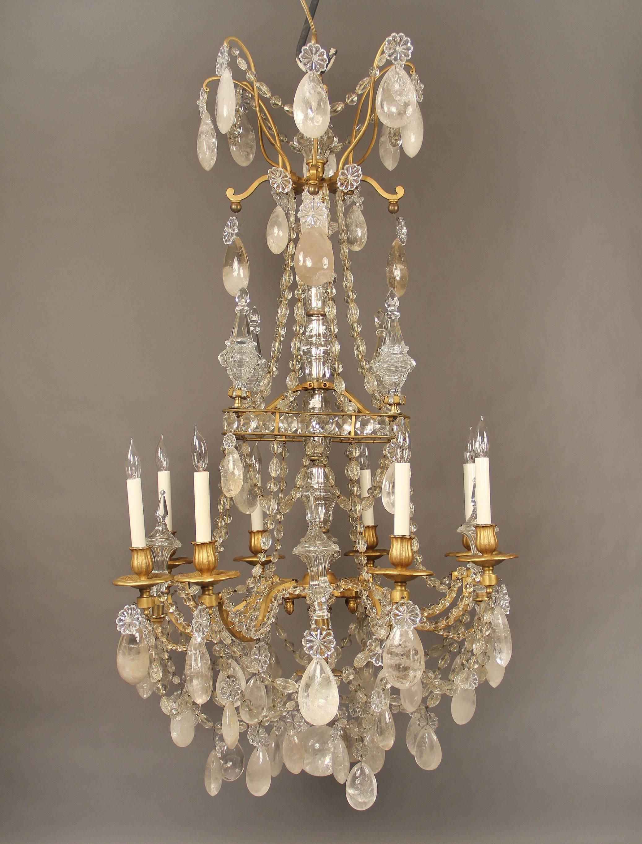 A lovely late 19th century gilt bronze and rock crystal eight-light chandelier.

Attributed to Gagneau Frères.

Full pear shaped and tear drop rock crystal, beaded arms and swags, eight-tiered spears, cut crystal central column.

The pre-eminent
