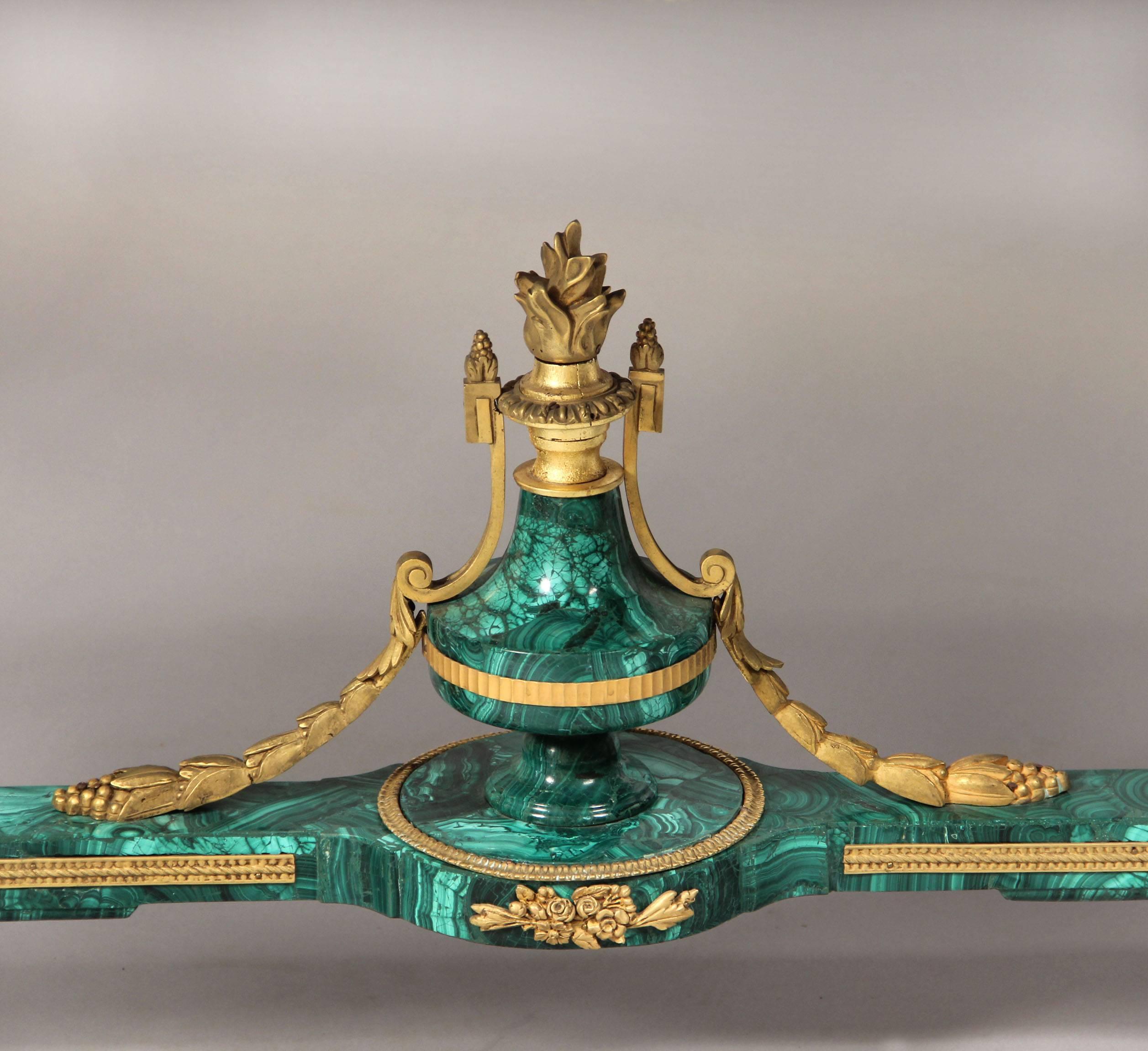 Fantastic quality late 19th century gilt bronze mounted Louis XVI style malachite center table

by Henry Dasson 1891.

Decorative malachite top above a frieze with two drawers, the legs joined by a stretcher centred by a bronze mounted