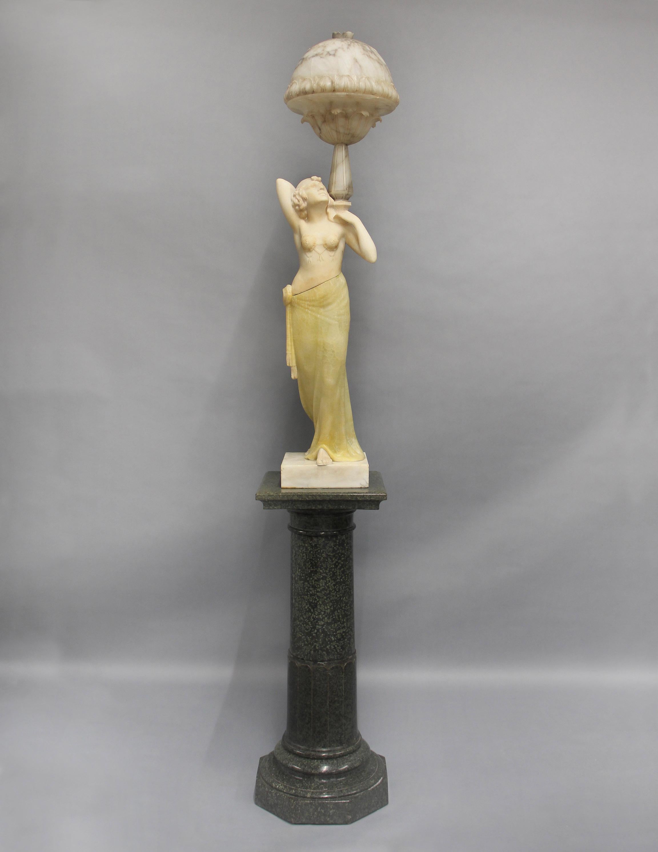 A Very Impressive Early 20th Century Italian Marble, Onyx and Alabaster Figural Sculpture Lamp by Professor Libero Gremigni

The beautiful Art Deco figural lamp depicting an Egyptian Revival dancing girl holding aloft a carved bowl shaped lamp