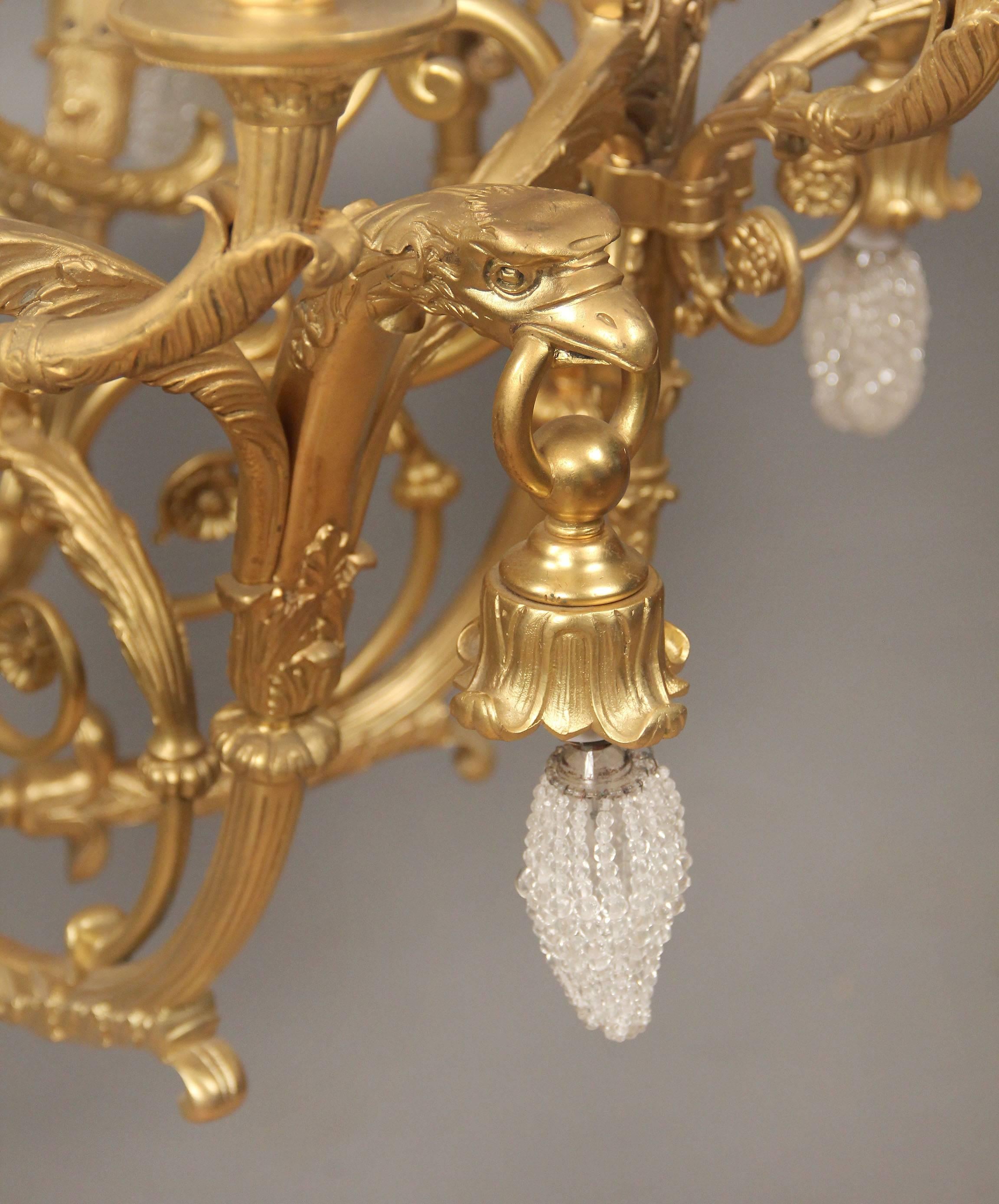 French Large and Important Early 20th Century Gilt Bronze Empire Style Chandelier For Sale