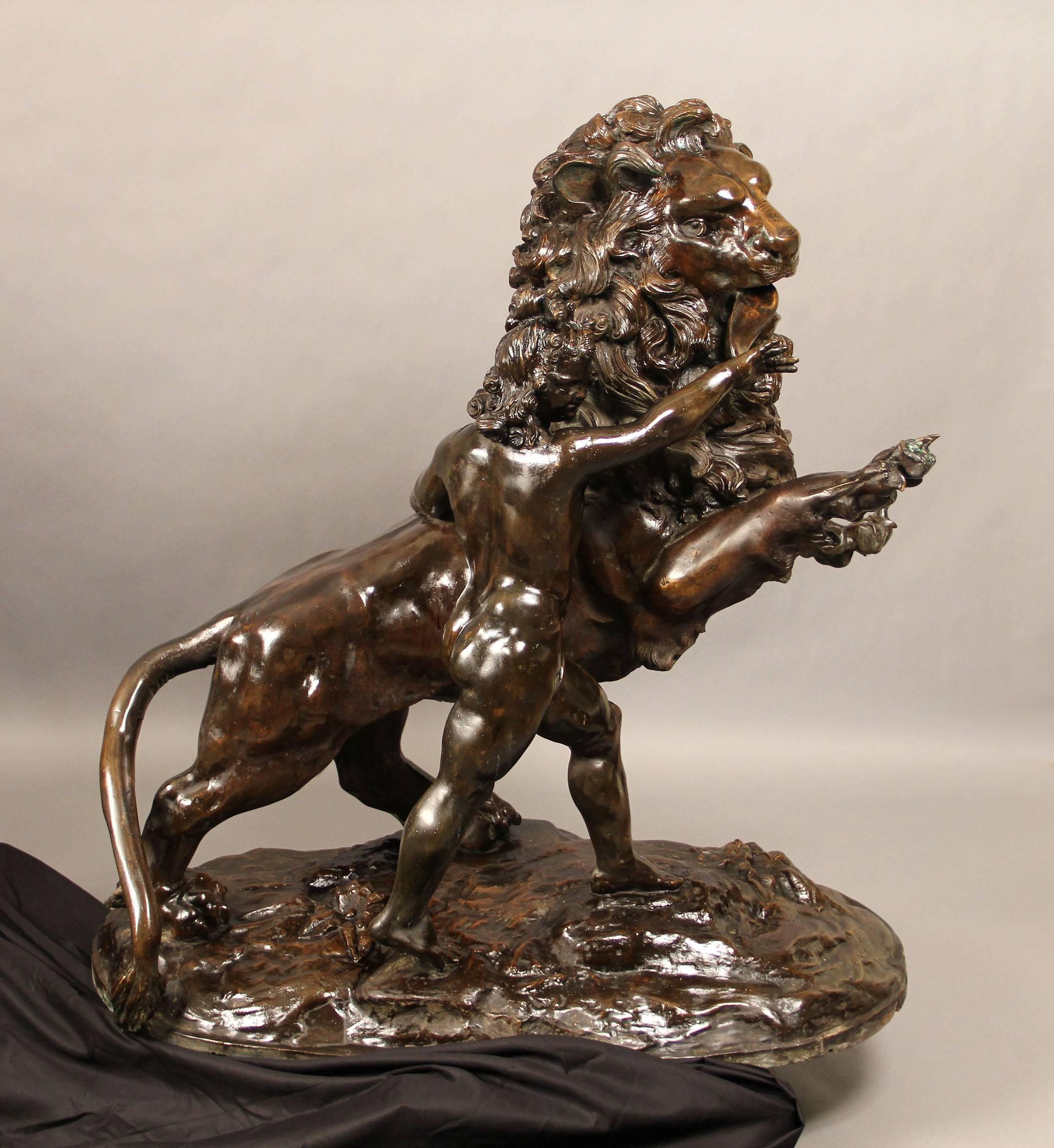 A large pair of early 20th century bronzes of a lion and tiger.

Both animals on their hind legs and front paws in the air, the tiger with a boy at its side, the lion with a girl at its side, standing on a large bronze base.