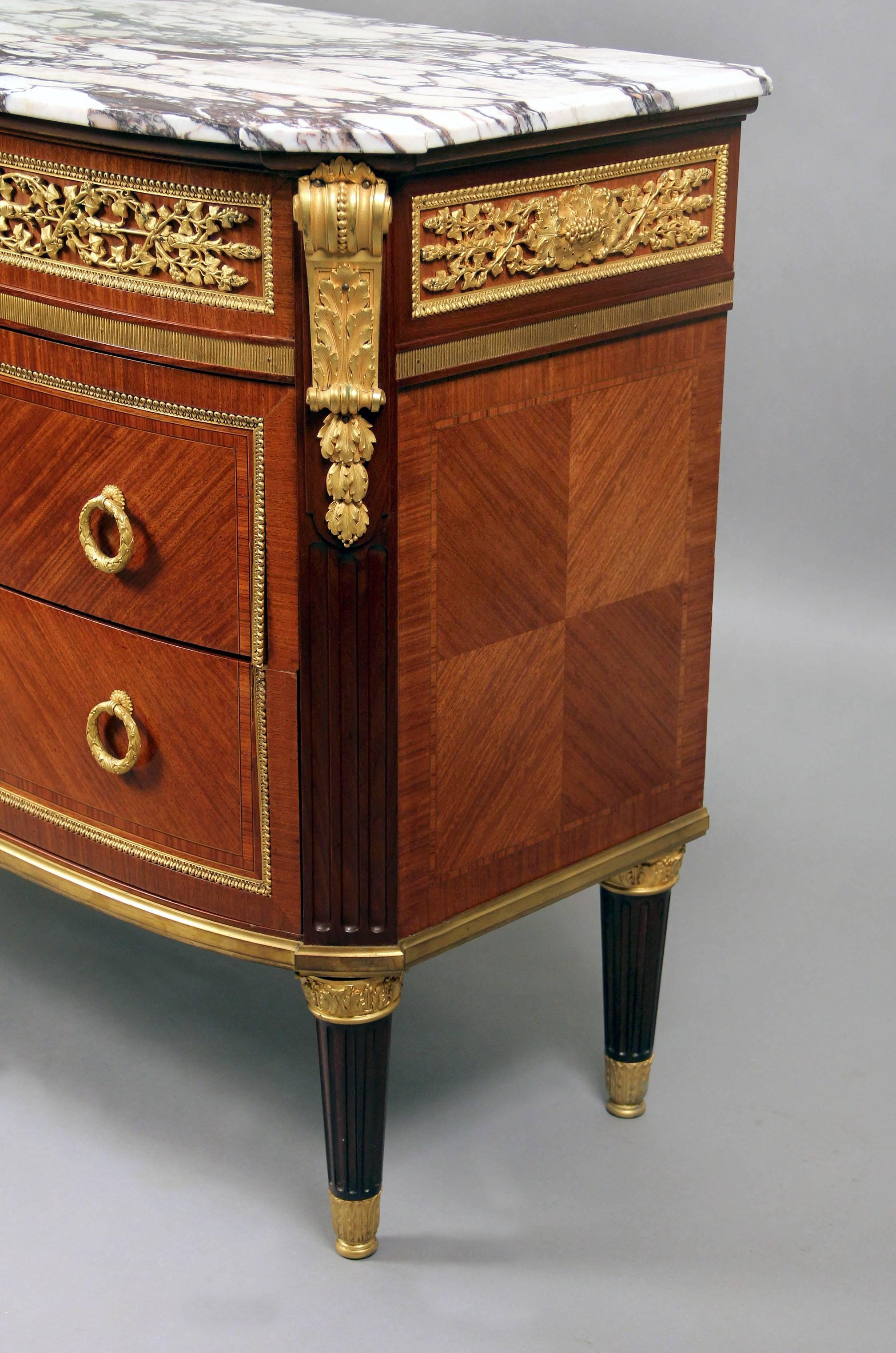 A late 19th century Louis XVI style gilt bronze-mounted commode

Signed Haentges Fres

A marble top, above a bronze frieze, with one long drawer, and two deep long drawers. Signature found on the wood near the lock on the upper drawer.

After