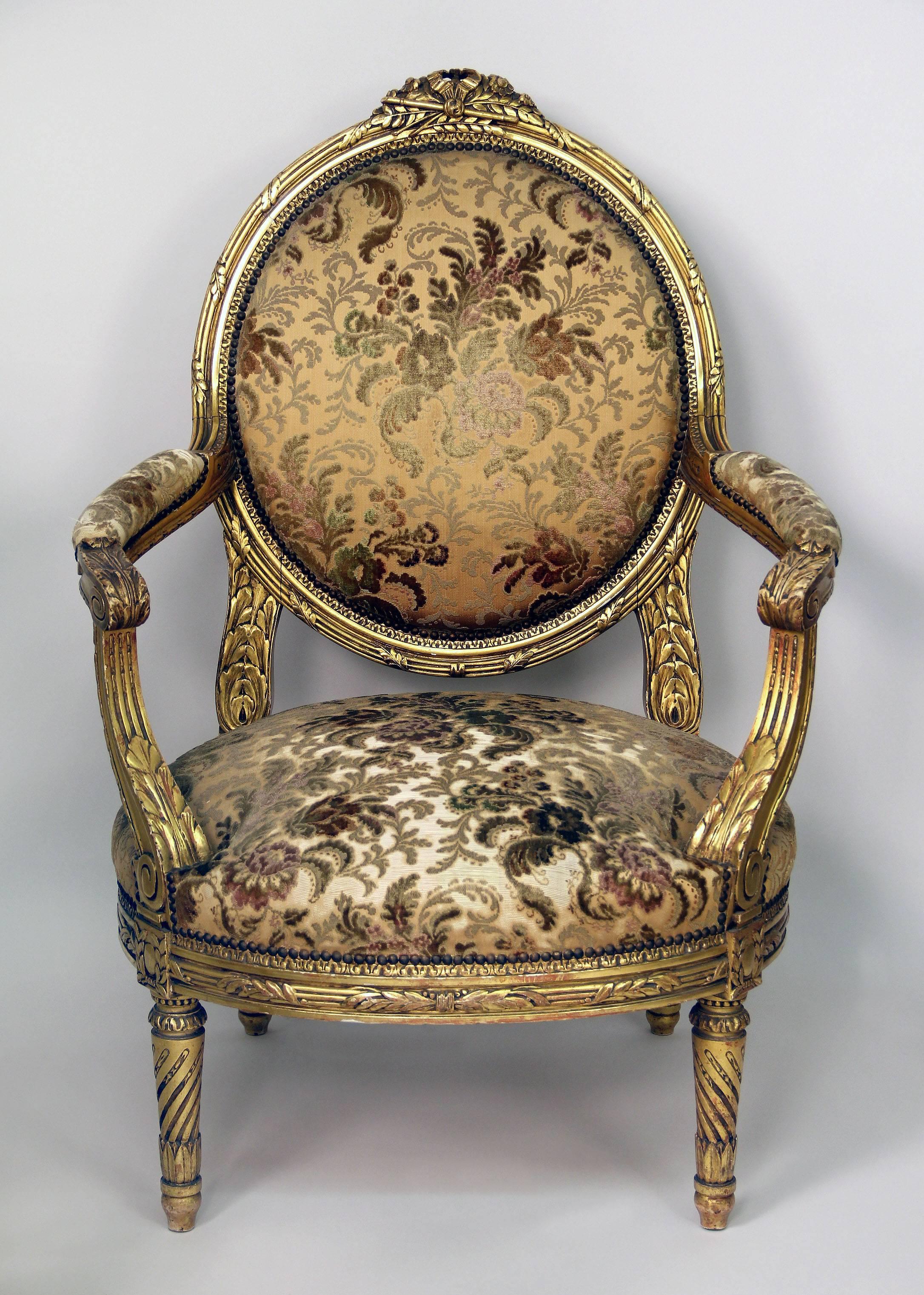 An important set of four late 19th century Louis XVI style giltwood armchairs

Oversized with high backs, wonderful hand-carved designed frames.
