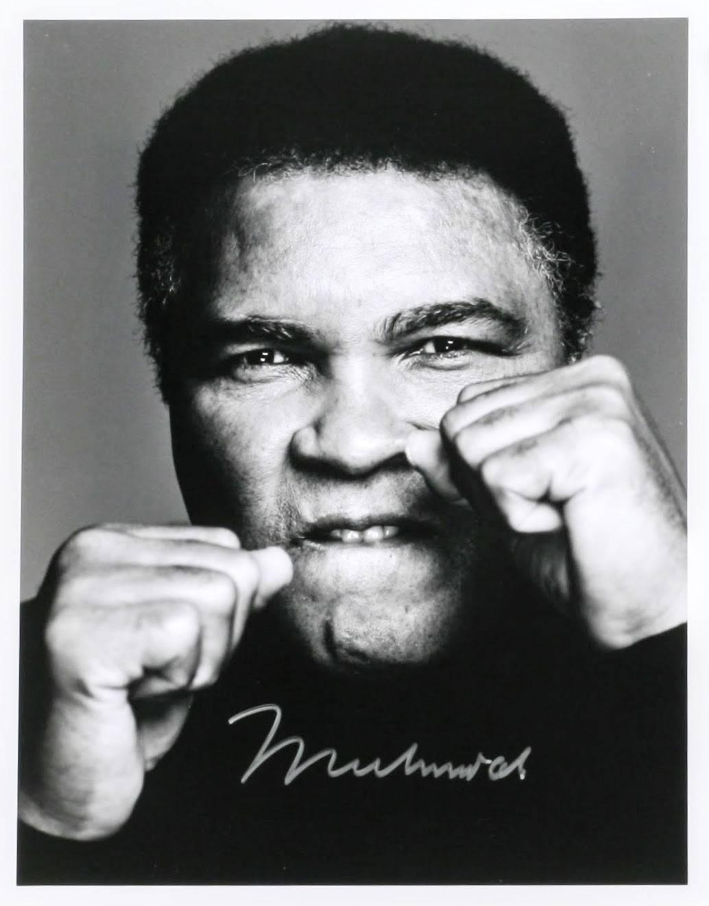 Each of the three 11x14 inch silver prints is signed by Ali in silver marker on the front of the image; each image is also signed by Corman on the verso and marked “1 of 1”. The Ali signatures are particularly strong and bold. 

Trained under