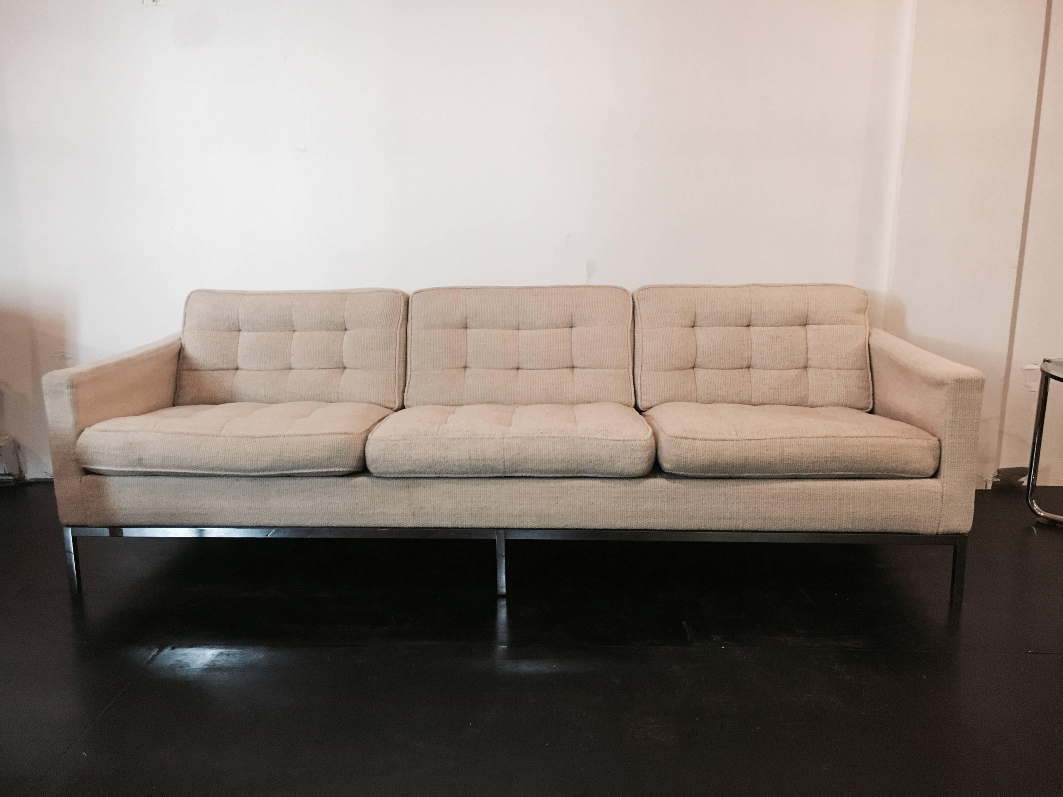 Three-seat sofa designed by Florence Knoll for Knoll Associates, circa 1955. Tubular Steel frame, upholstered in a woven wool Knoll textile.