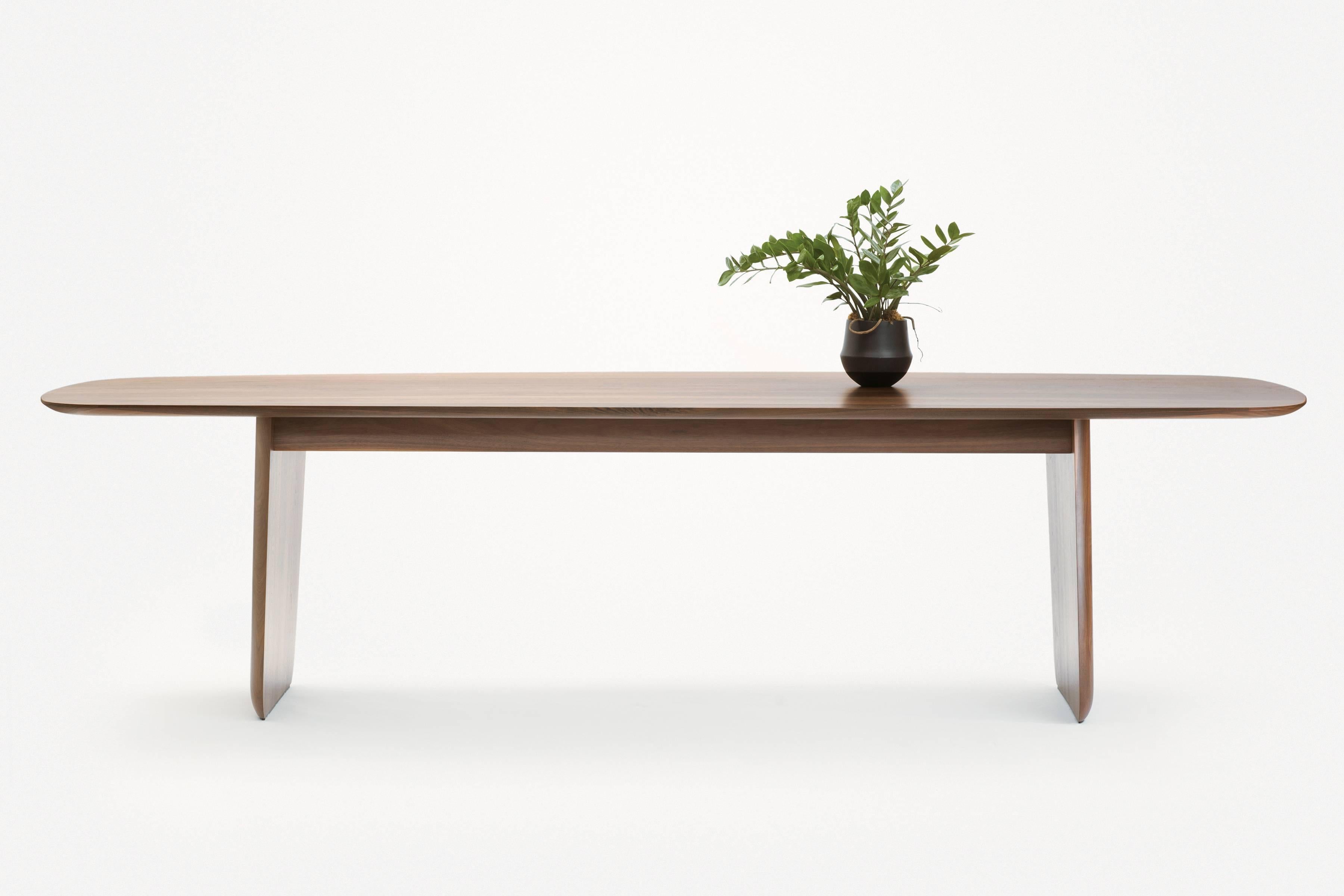 Plinth dining table, a massive solid wood table made in Pennsylvania, designed by the trio—Theo Richardson, Charles Brill and Alexander Williams.

Materials:
Solid wood.
PL-8W walnut.

Dimensions:
118 L x 39 W x 30