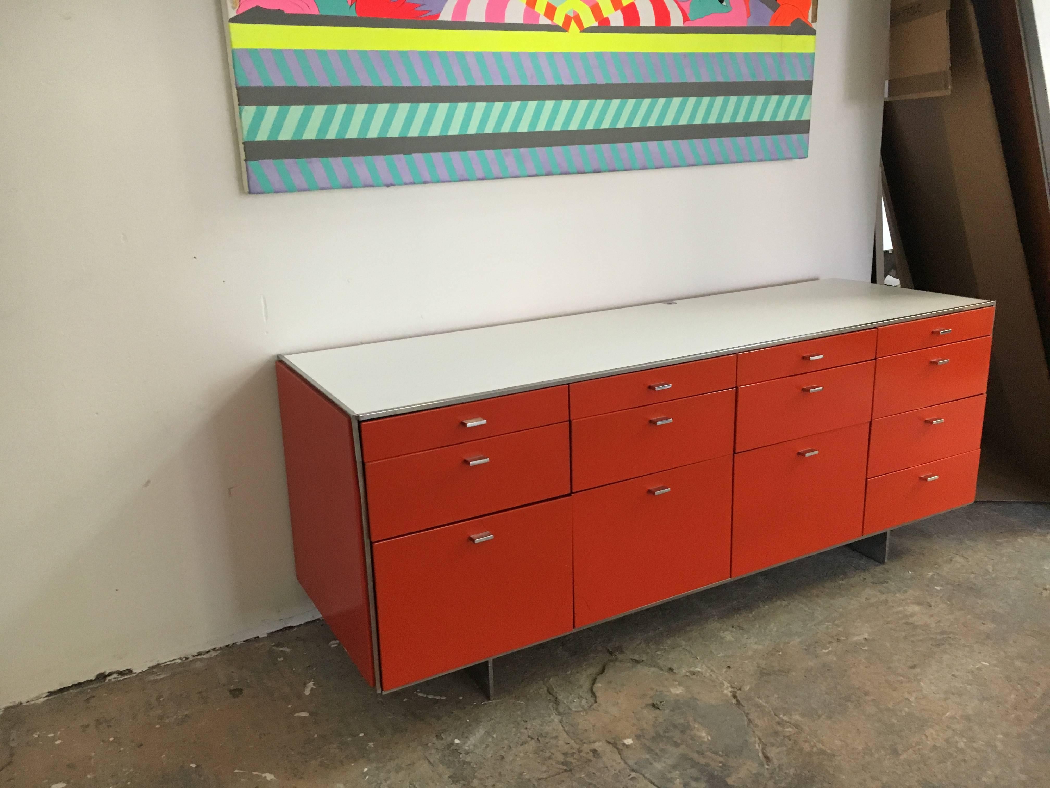 Credenza designed by Davis Allen, made by GF, circa 1968.
Enameled steel with chrome base and pulls, white laminate top,
lock on the right side.