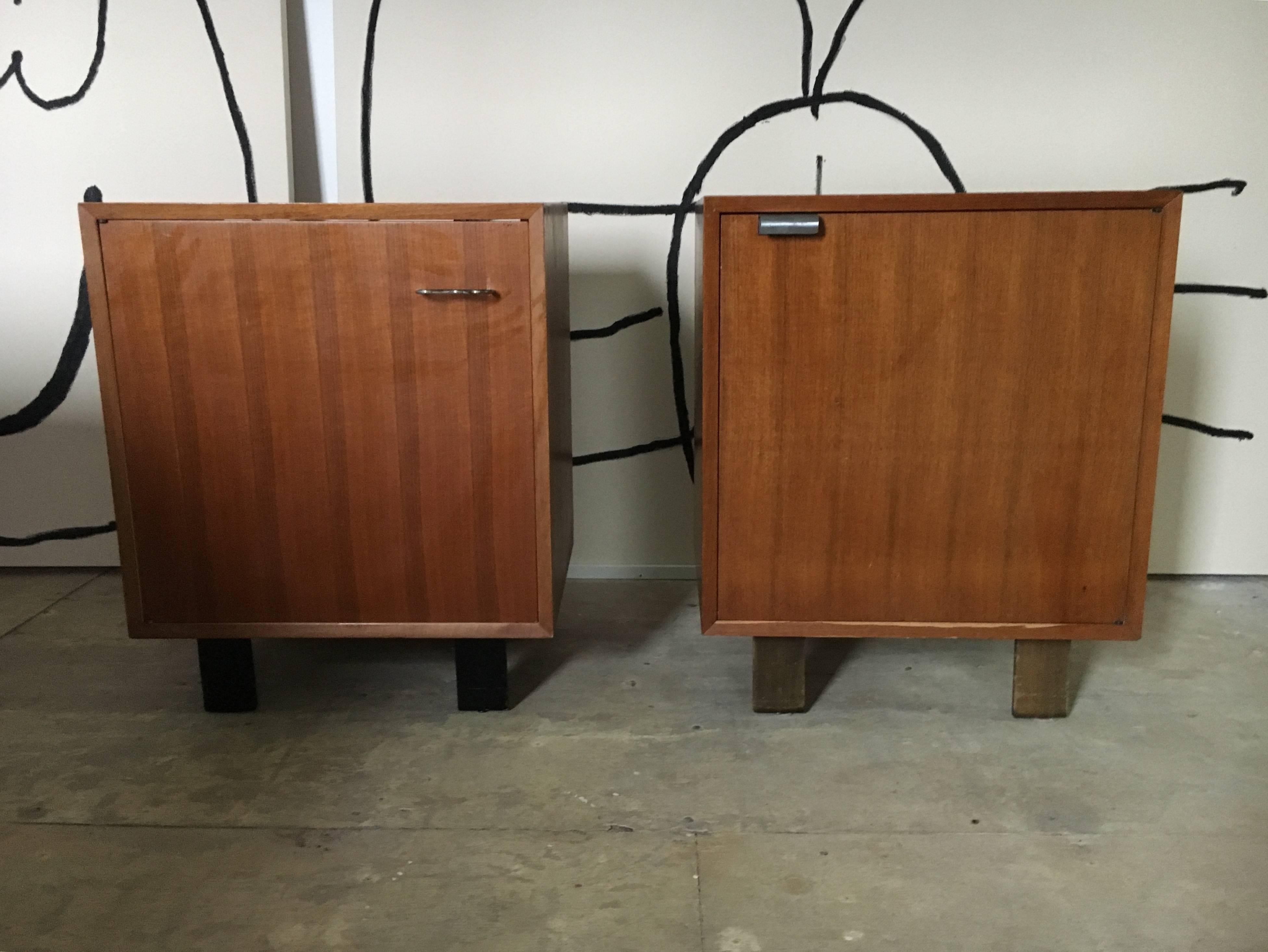 Pair of walnut cabinets designed by George Nelson for Herman Miller in 1948.
One shelf each, the right cabinet has a J-handle and the left one a M-handle.
