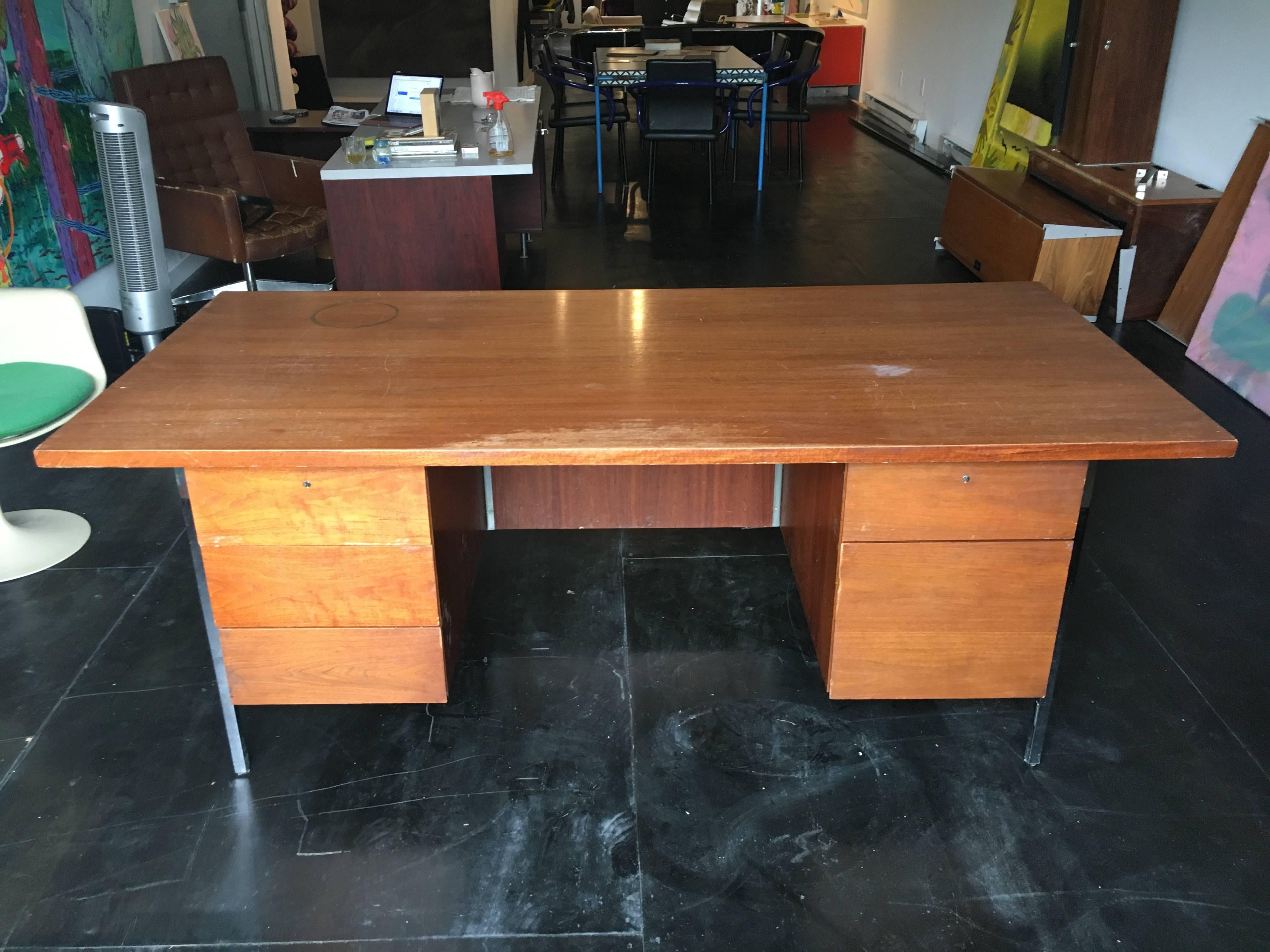 Modern Executive desk, designed by Florence Knoll for Knoll, circa 1960s. Large-scale with a clean lined architectural design. In original condition consistent with age and use. Could profit from being refinished and can be completed in your choice