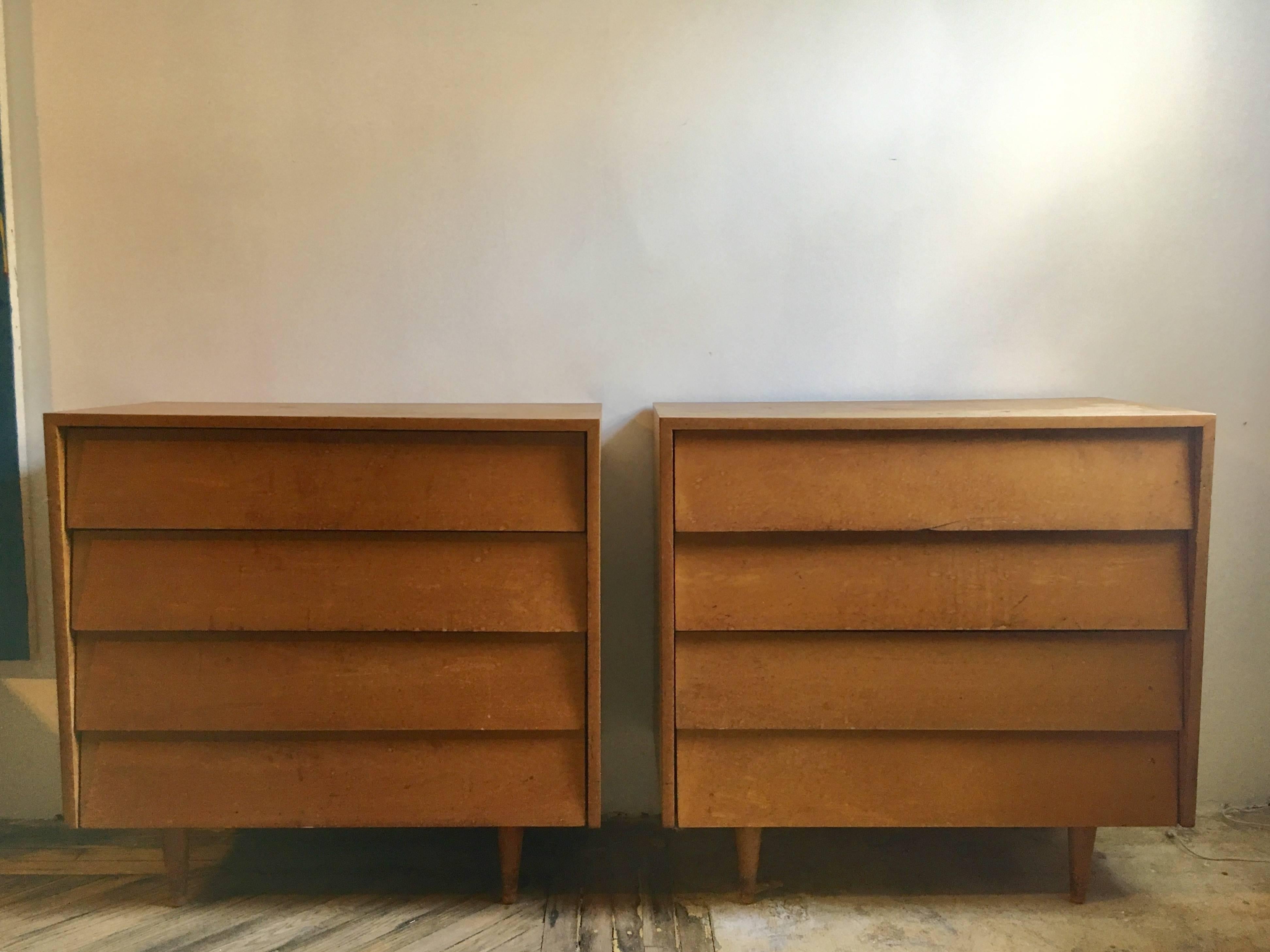A pair of maple dressers designed by Florence Knoll, featuring slant front drawers, set on tapered feet.

Vintage condition, they can be refinished for an additional fee.