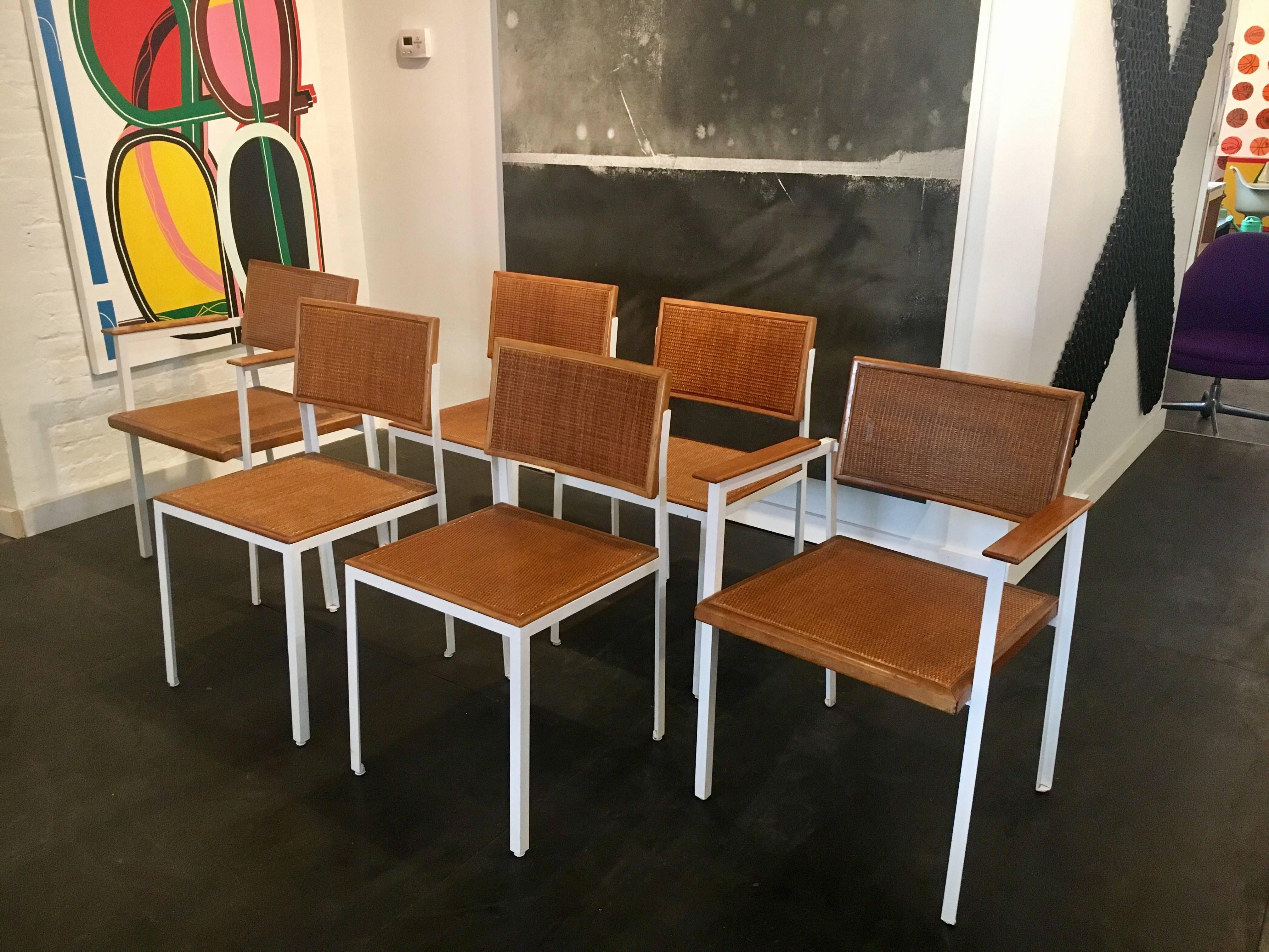 Set of six caned birch steel frame chairs, two-arm chairs and four side chairs, designed by George Nelson for Herman Miller in 1952.
 