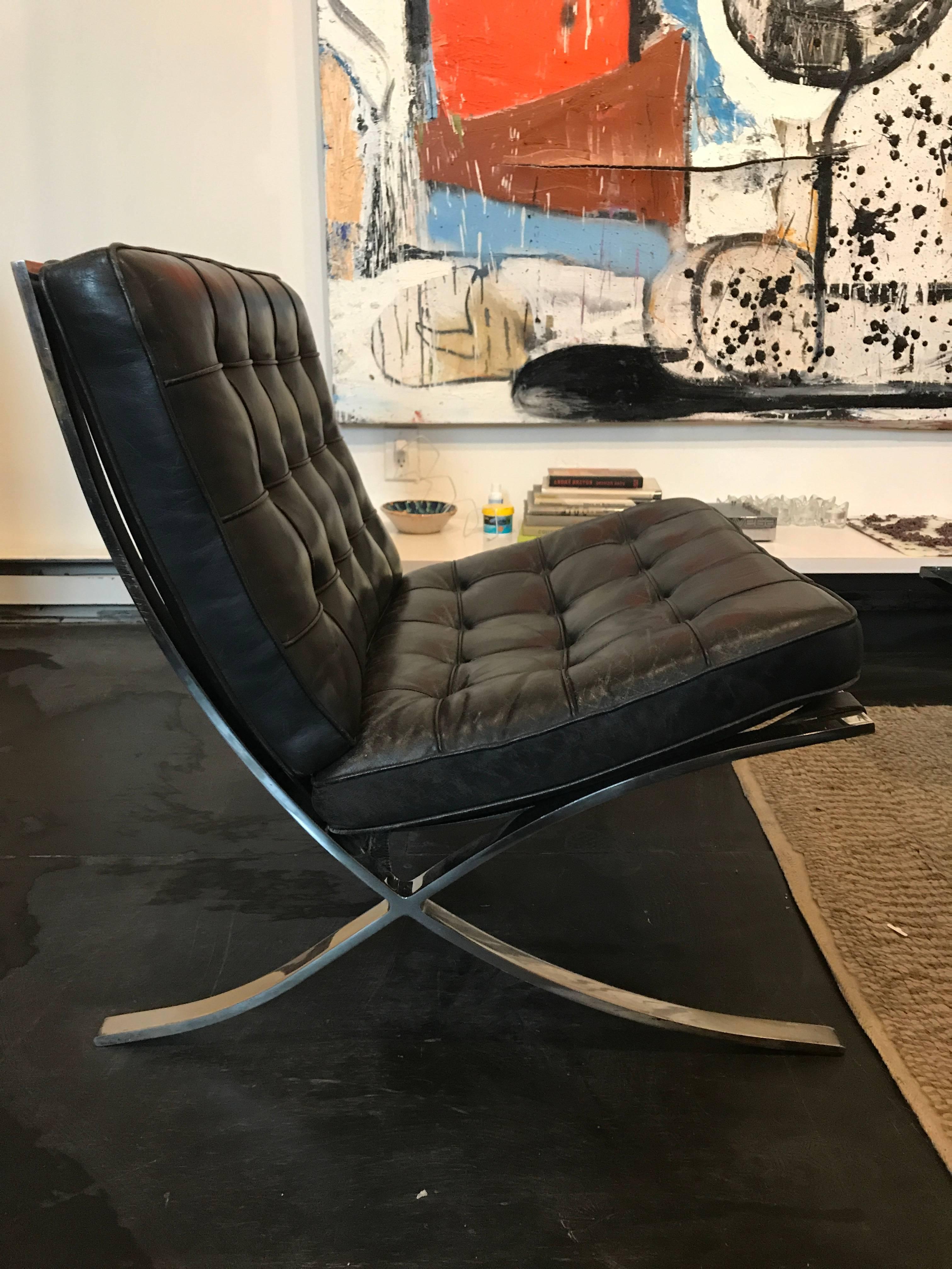 Mies van der Rohe Barcelona chairs for Knoll. Stainless steel frames and original black leather with just the right amount of wear.