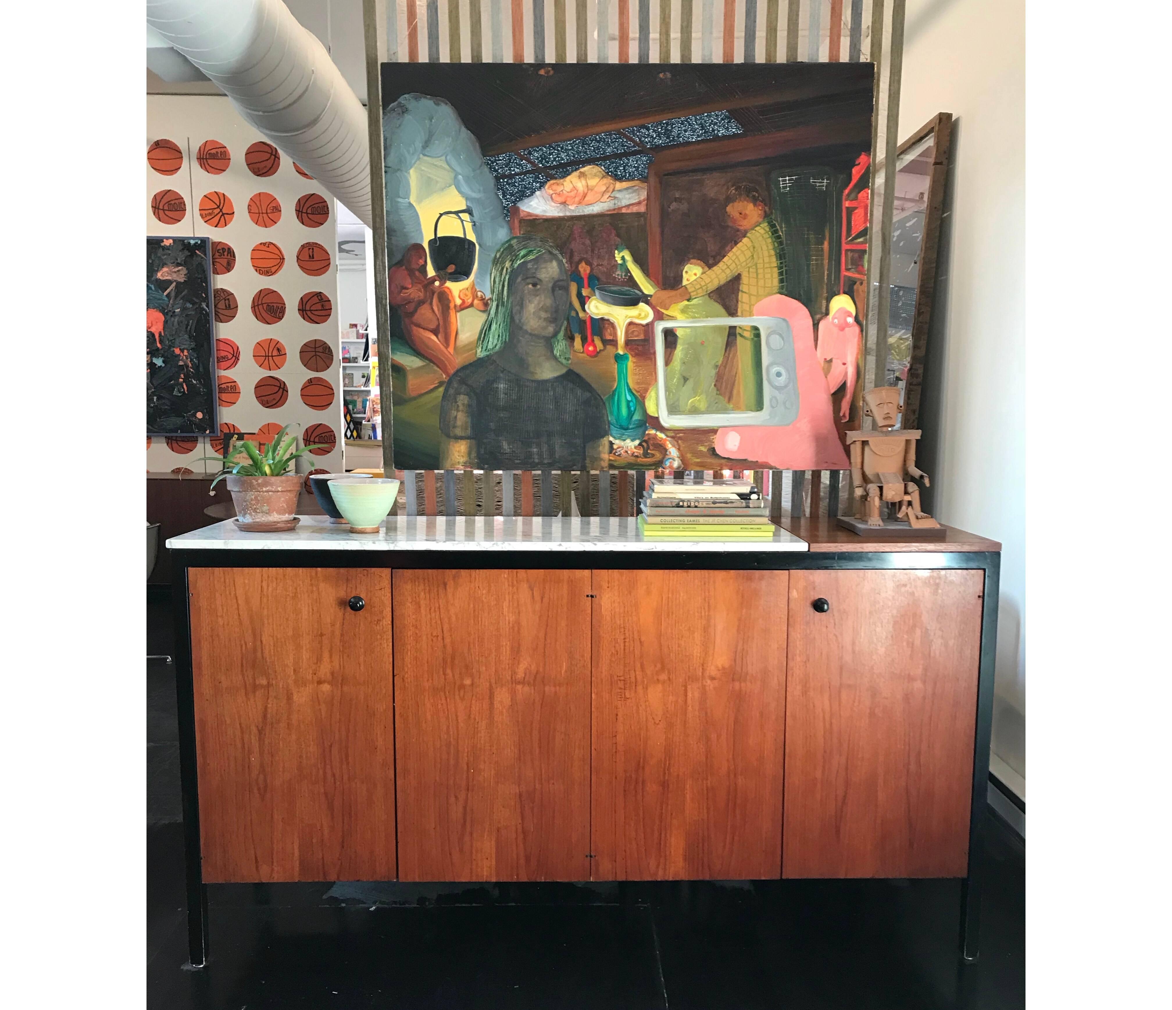 Marble-top black frame group double buffet designed by George Nelson for Herman Miller in 1959. Four doors enclosing four shallow pull-out trays and two adjustable shelves. Lift lid enclosing hot plate. These cabinets are some of the rarest and most