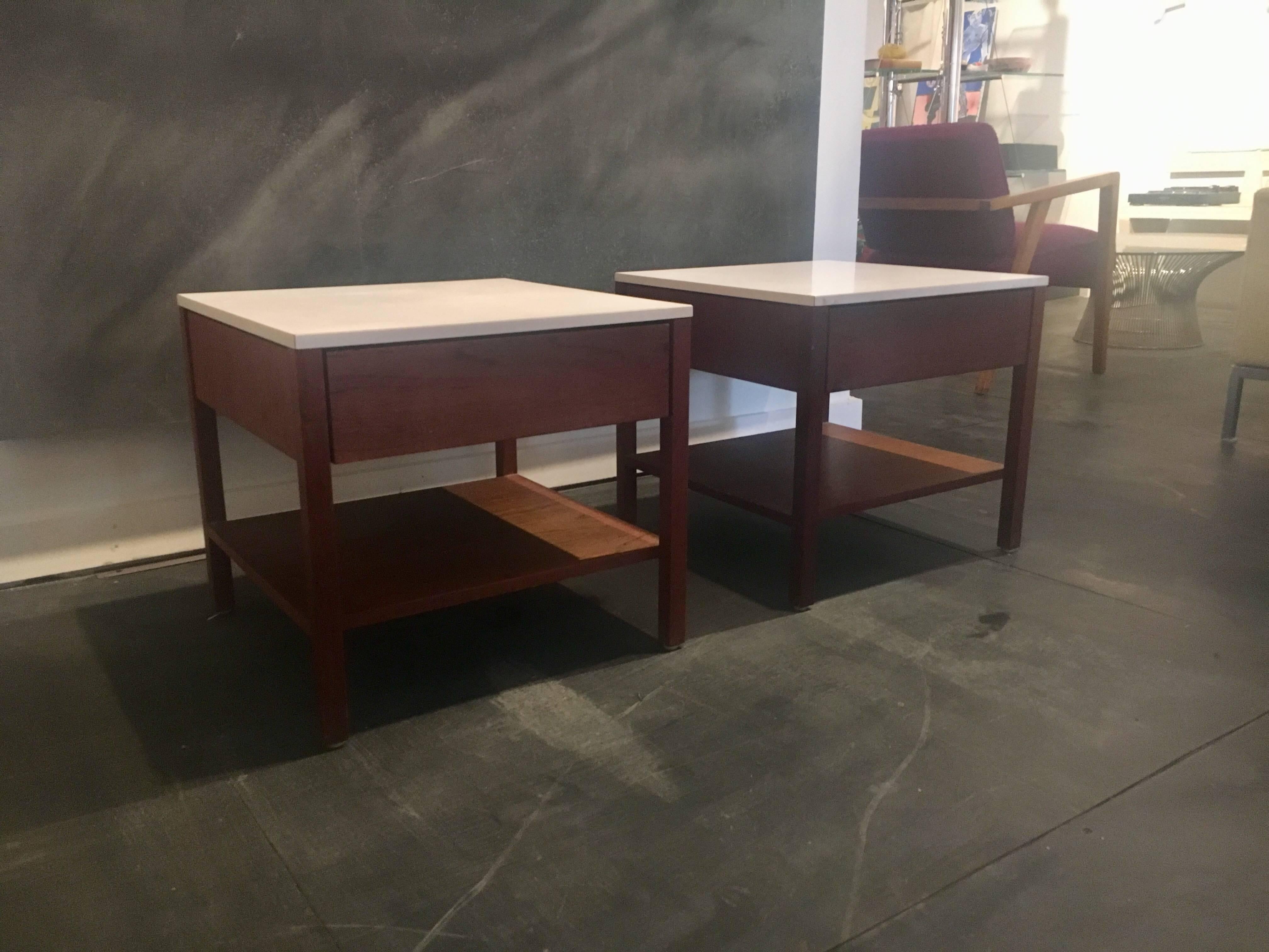 Pair of walnut end tables or nightstands designed by Florence Knoll, circa 1959, manufactured by Knoll.
White laminate tops.