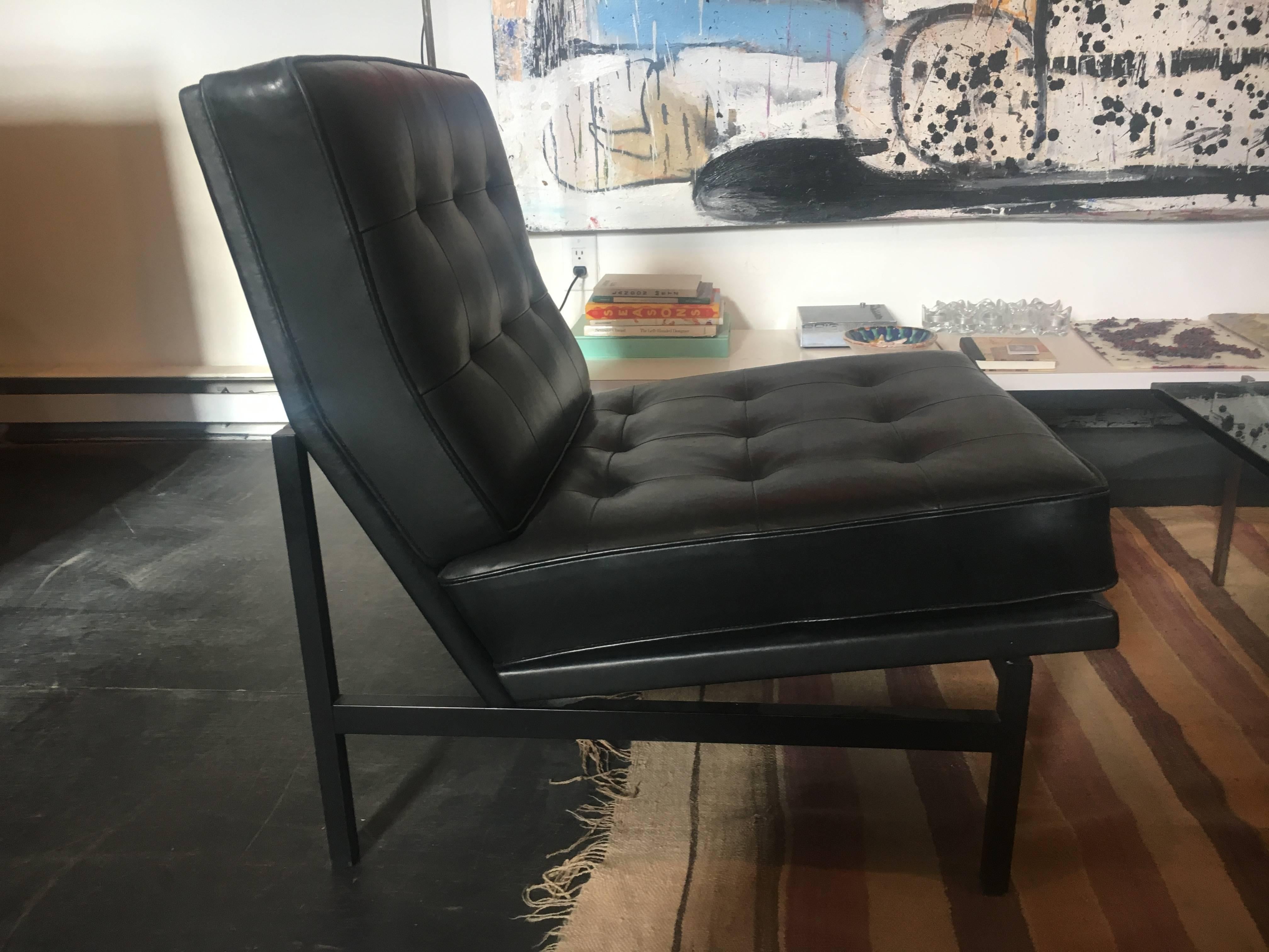 Pair of black leather parallel bar chairs with rare original black bases. Designed by Florence Knoll, circa 1958.