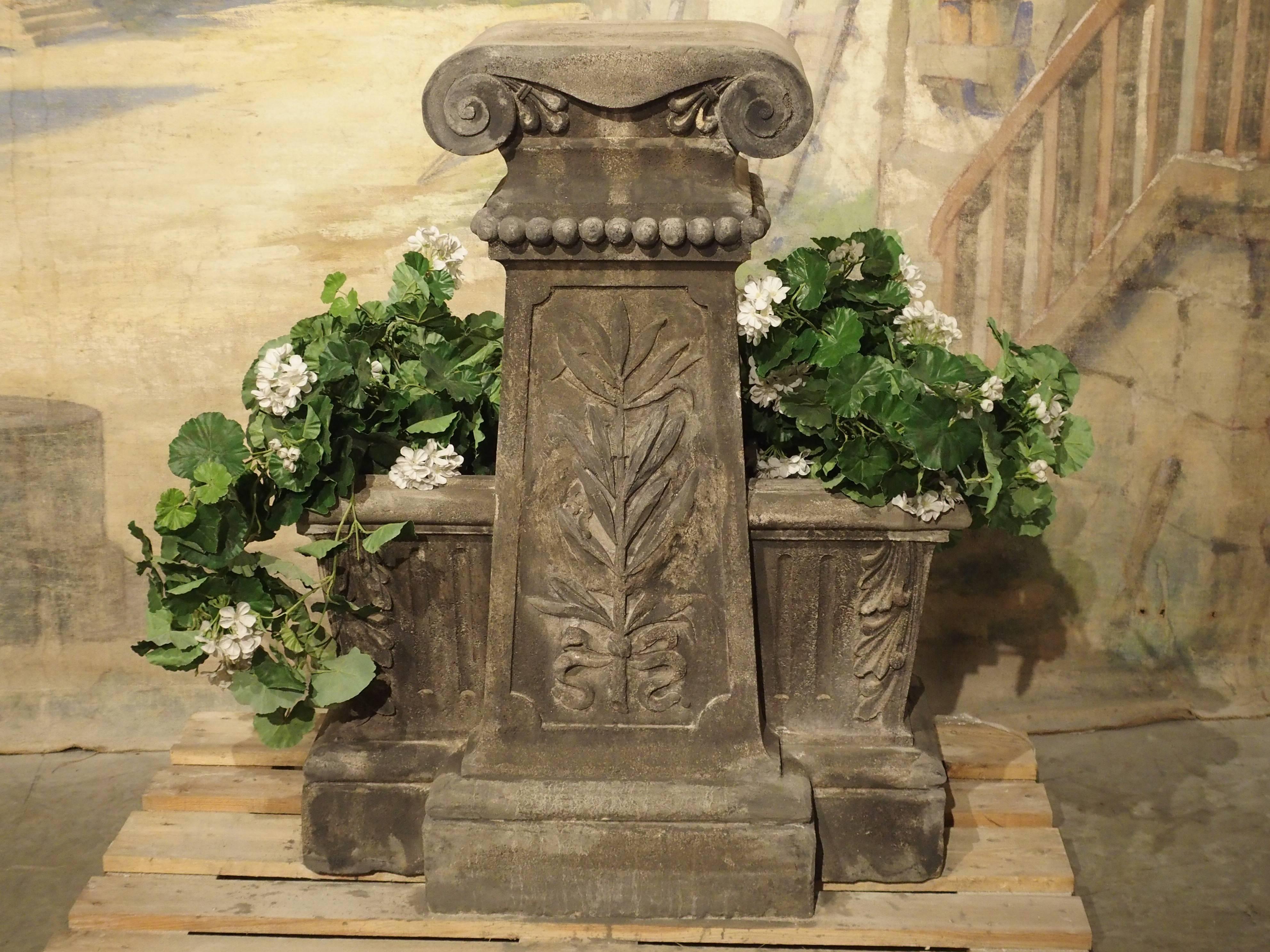 This interesting antique French double planter was made with reconstituted stone in the late 1800s. The maker used a natural stone composite as a base, so it appears to be pure carved stone. With well over 100 years of weathering, we decided to