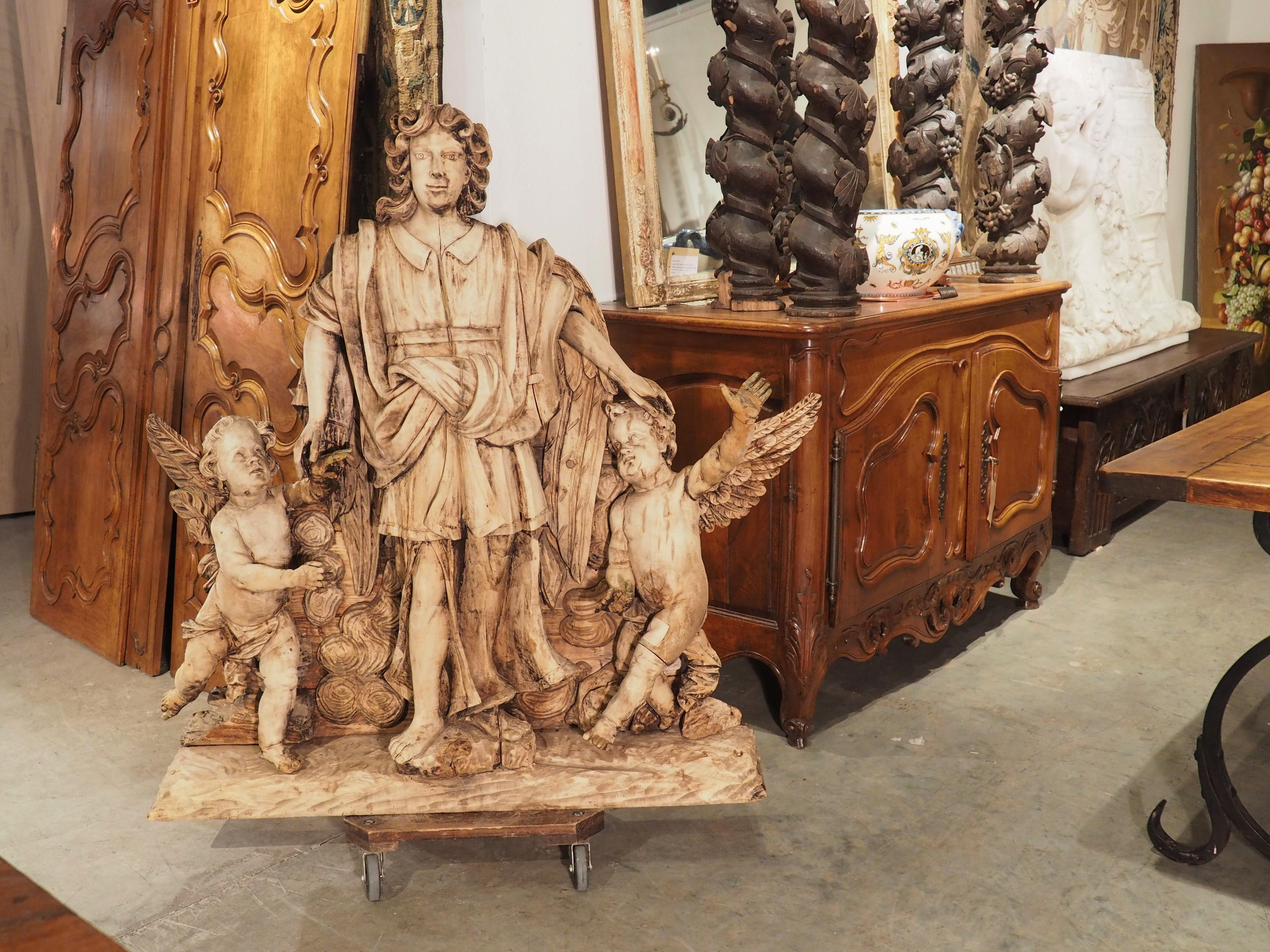 Large 18th Century Wooden Carving of an Angel with Cherubs For Sale 3