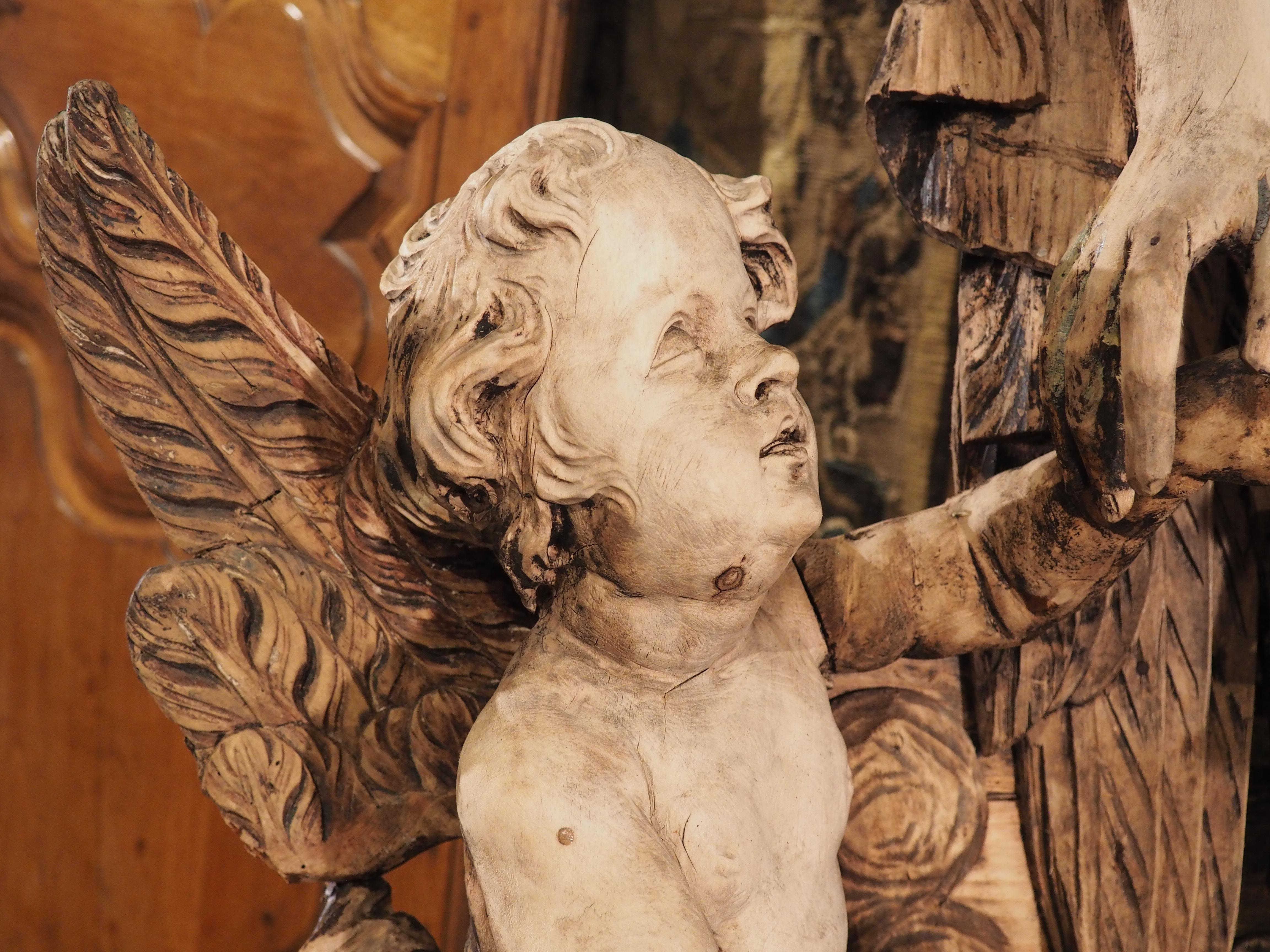 18th Century and Earlier Large 18th Century Wooden Carving of an Angel with Cherubs For Sale