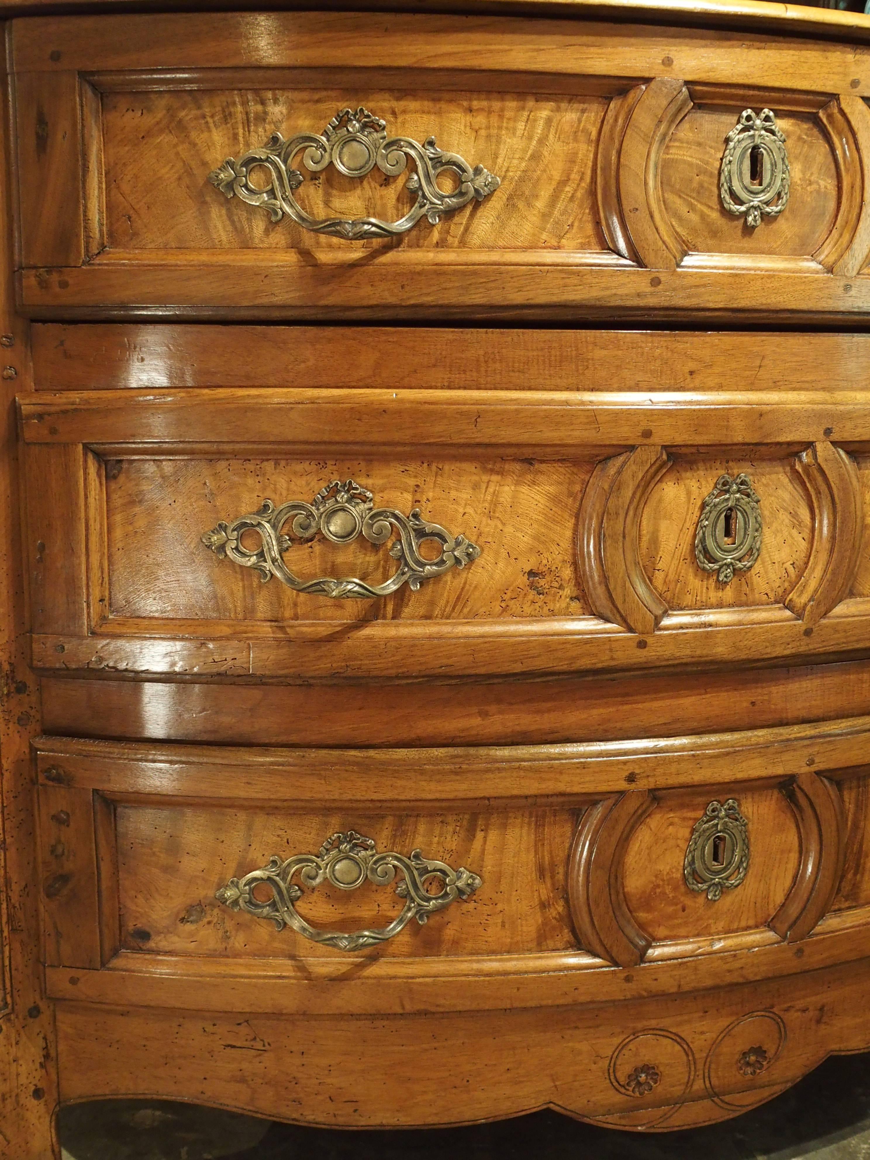 Walnut and burled walnut.

In 1700s France, the commode was considered the finest piece of furniture in the chateau. It was also placed in the most important areas so it could be seen. This particular commode from Bourgogne or Vallee du Rhone