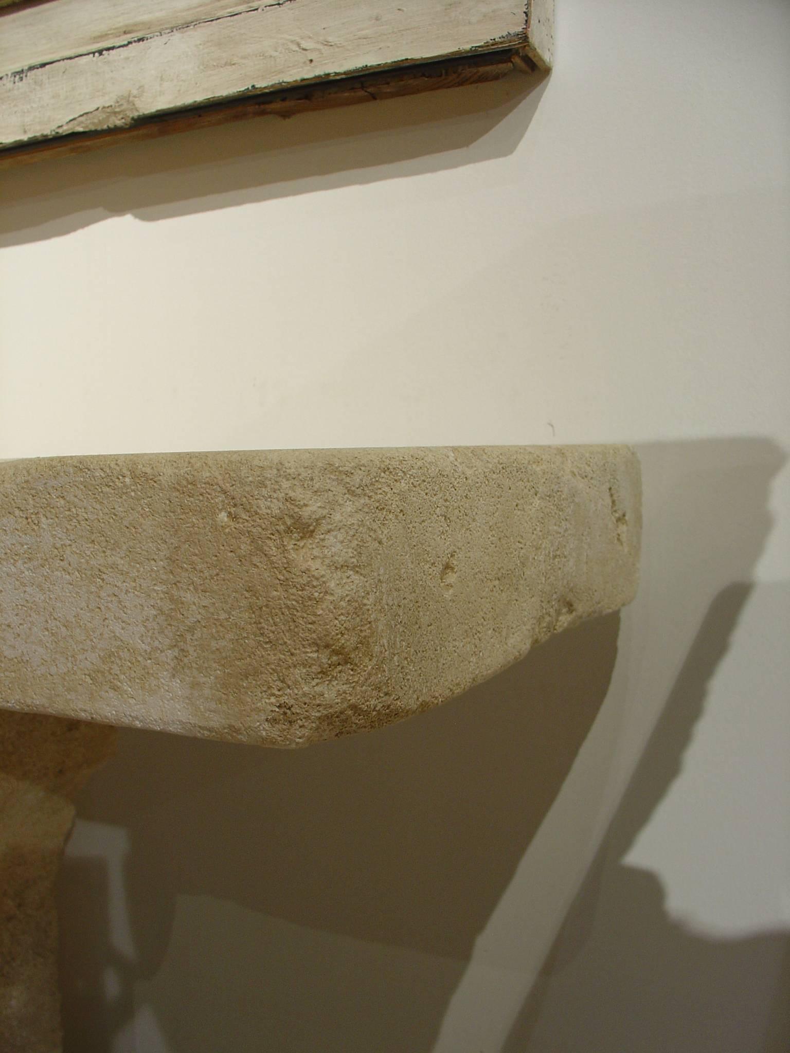 This is a narrow, hand carved, limestone consoles came from Provence, France. They are rectangular and rest on shaped pedestals having small rectangular plinths. 