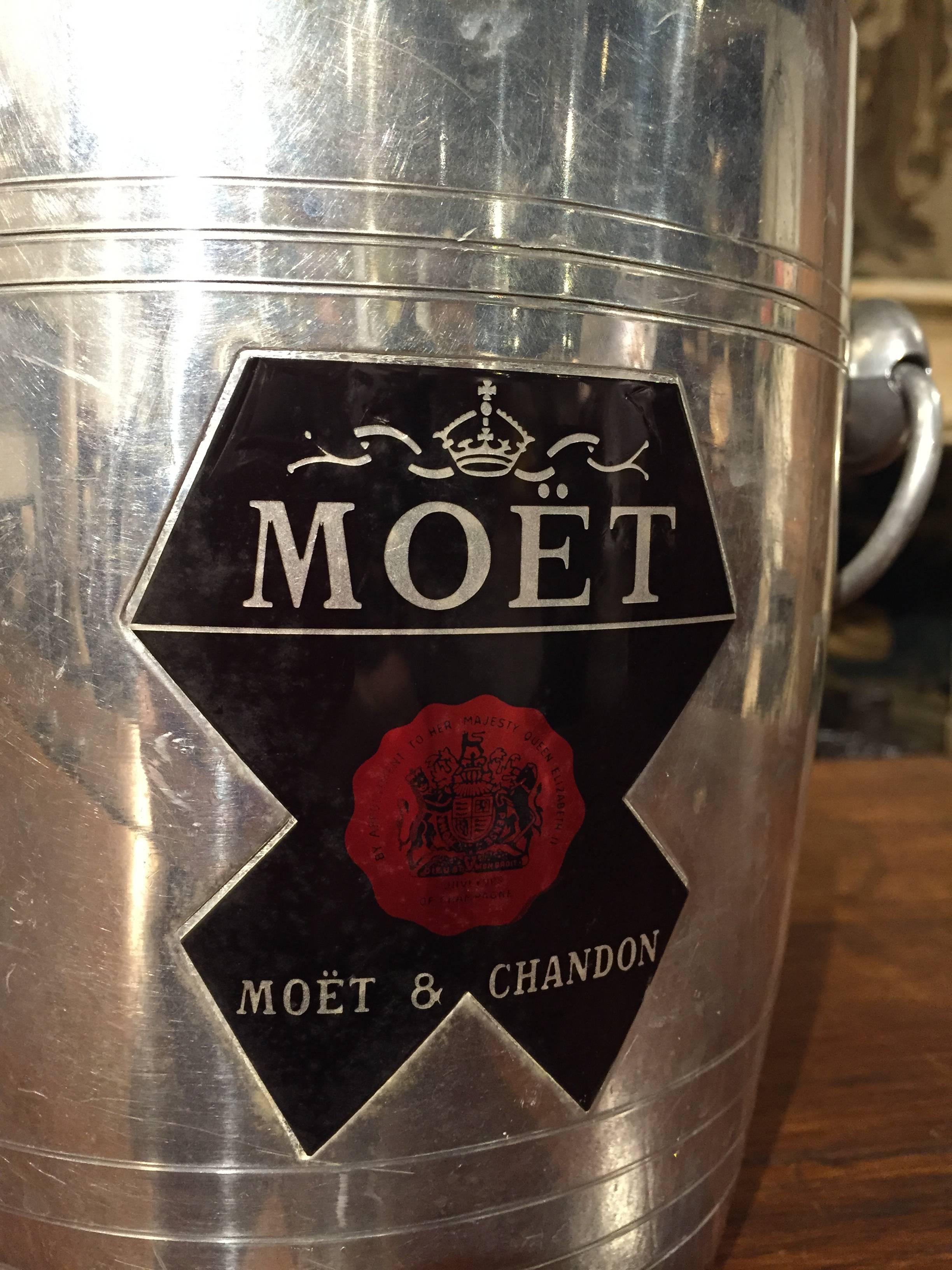 This champagne bucket has the label for the Moet & Chandon founded in 1743 by Claude Moet.  Stamped by maker on bottom, and handles make it easy to transport. Original vintage bucket and very decorative when not in use. Light signs of use nothing