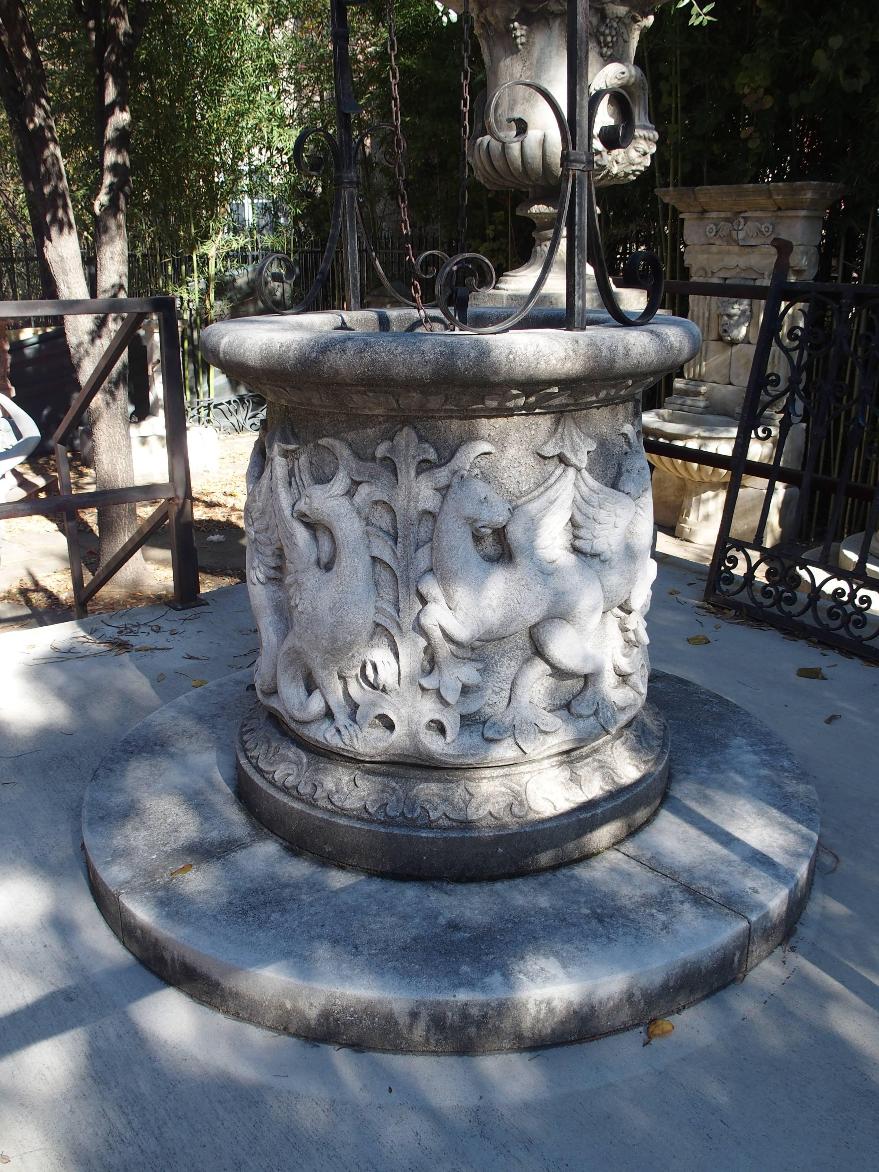 This beautiful well is made of a tight grained limestone from Northeastern Italy. The entire wellhead has been cut from one single block of stone by master Italian stone artisans. It has wonderful deep carves featuring griffins, fantastical sea