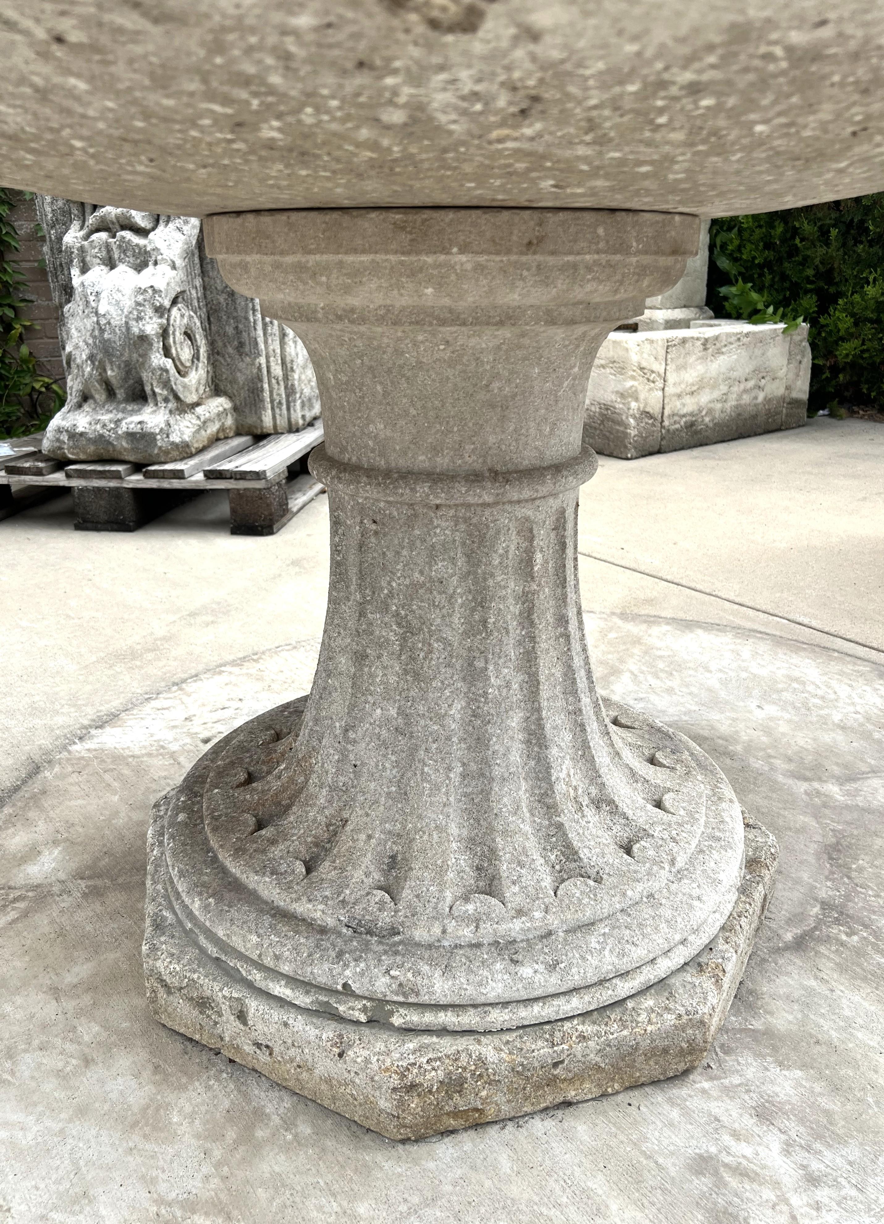 Hand-Carved Early 1900s French Circular Limestone Table with Fluted Octagonal Base For Sale