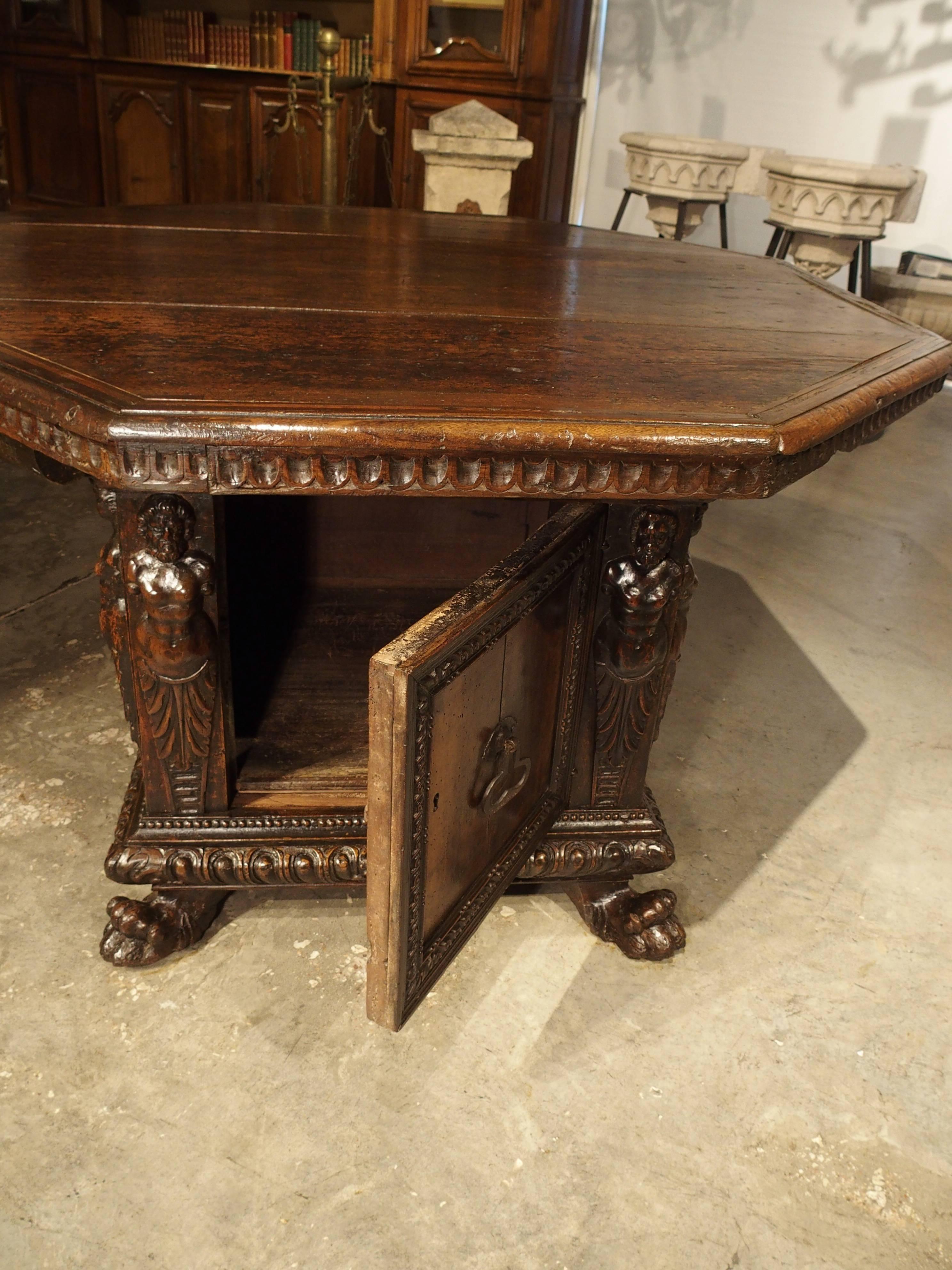 Dating to the high Renaissance period (1500s), this rare antique Italian table with octagonal top, was the precursor to the widely popular center table. Highlighting the angles of the top are four inlaid linear moldings surrounding the outermost