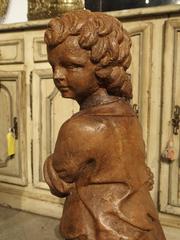 French Vintage Painted Cast Statue of a Boy Holding a Basket of Fruit