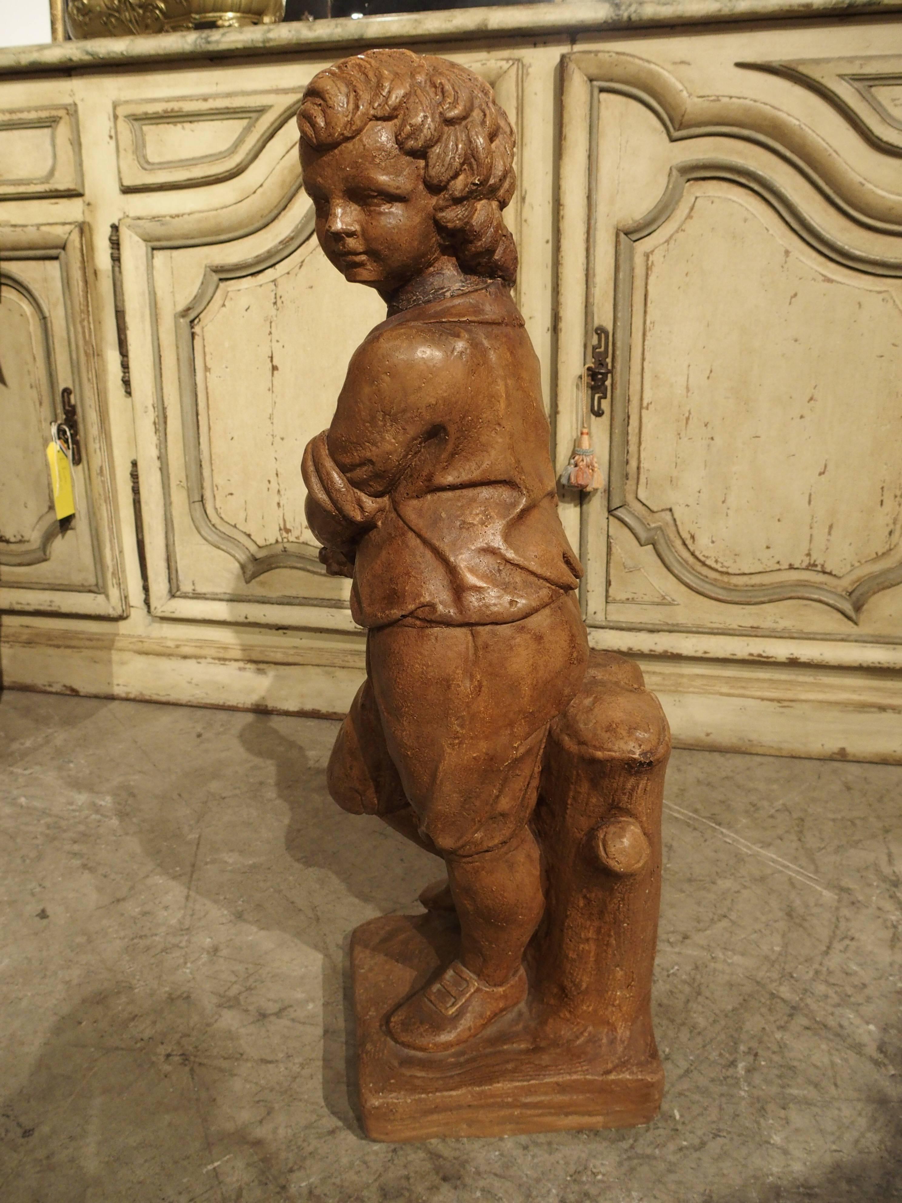 French Vintage Painted Cast Statue of a Boy Holding a Basket of Fruit In Good Condition In Dallas, TX