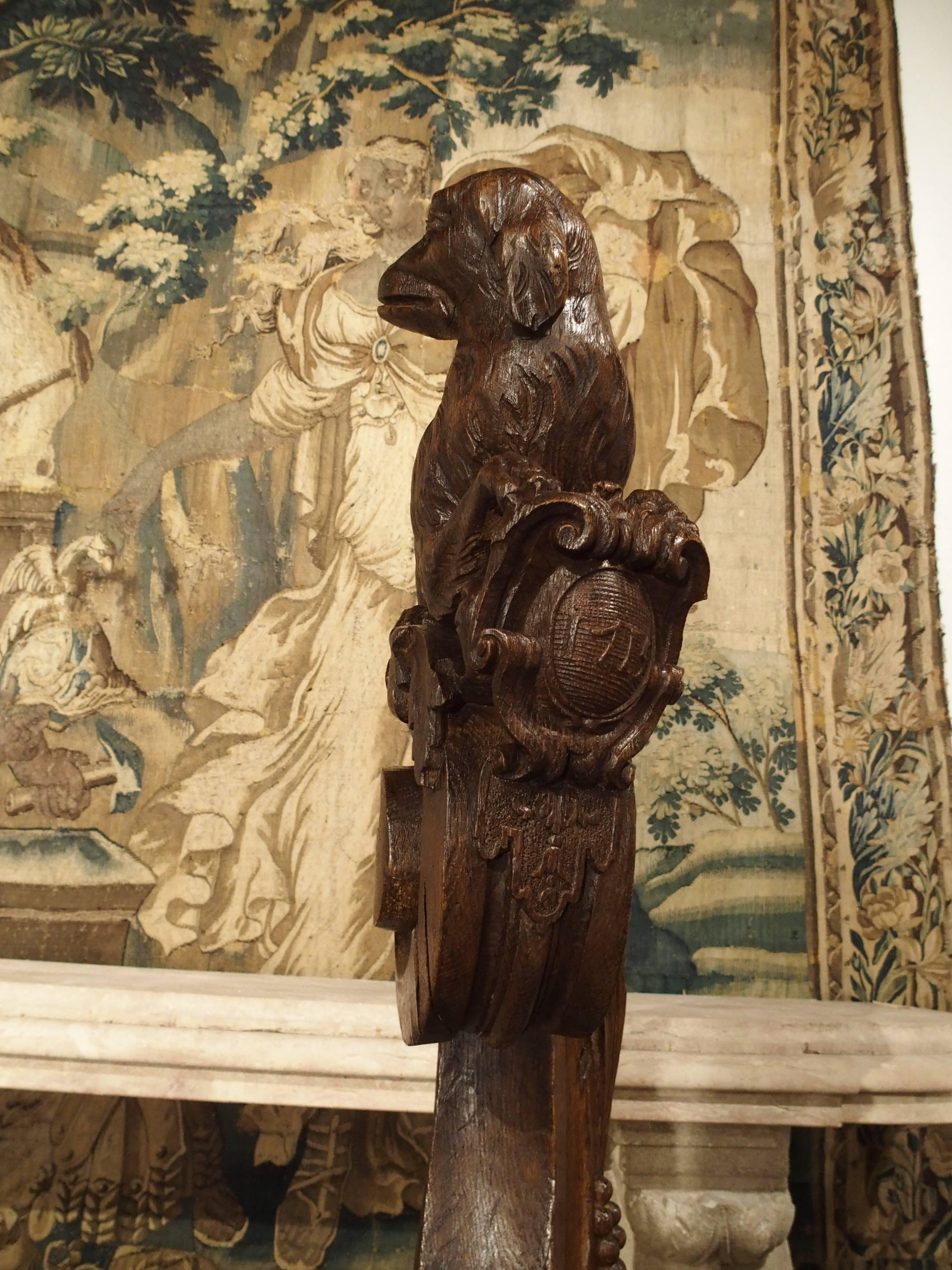 This wonderful French, hand-carved newel post dates to the final year of King Louis XIV (1643-1715). A wonderful dog rests atop a scrolling acanthus leaf c-scroll, while it's front paws hold a cartouche dated 1715 (please see photo.) Beneath the
