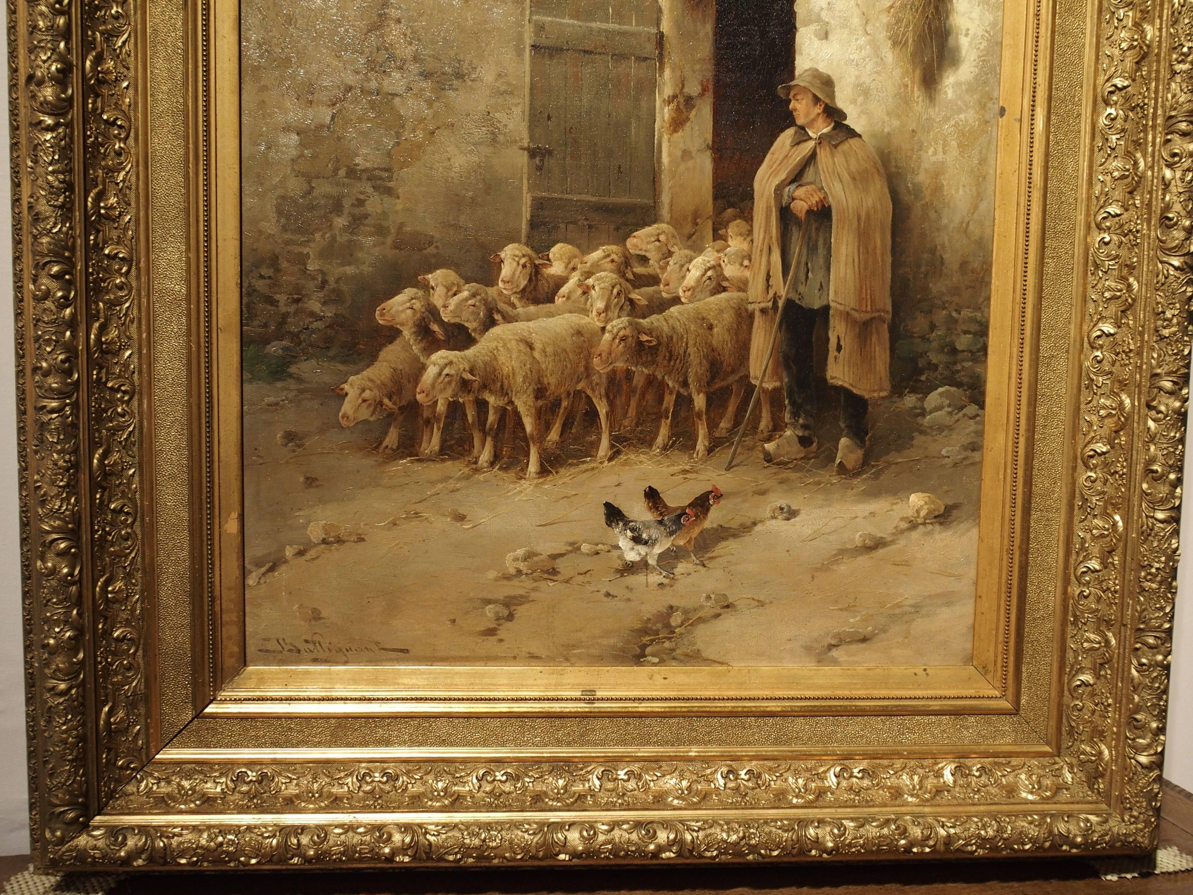 This peaceful genre style oil painting depicts a farmyard scene with chickens and sheep coming out of the barn for their exercise in the yard. The gentleman waits for the herd to completely exit before closing the door. At the top left corner of the
