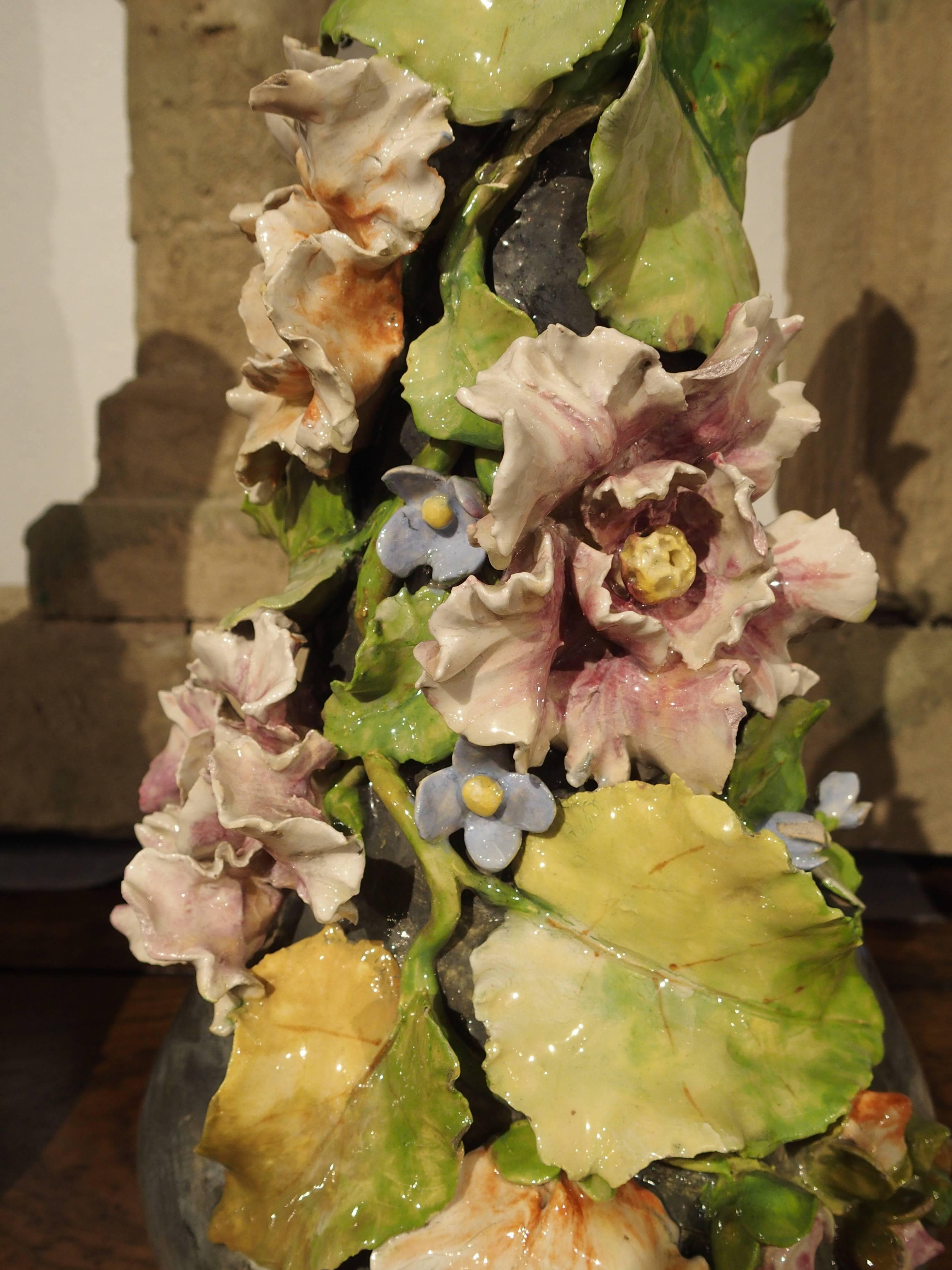 Theodore Lefront began working with faience and porcelaine in an atelier in Fontainebleau in 1860. He had several apprenticeships with various other porcelain ateliers until opening his own in 1872. Numerous exposition medals were awarded Lefront