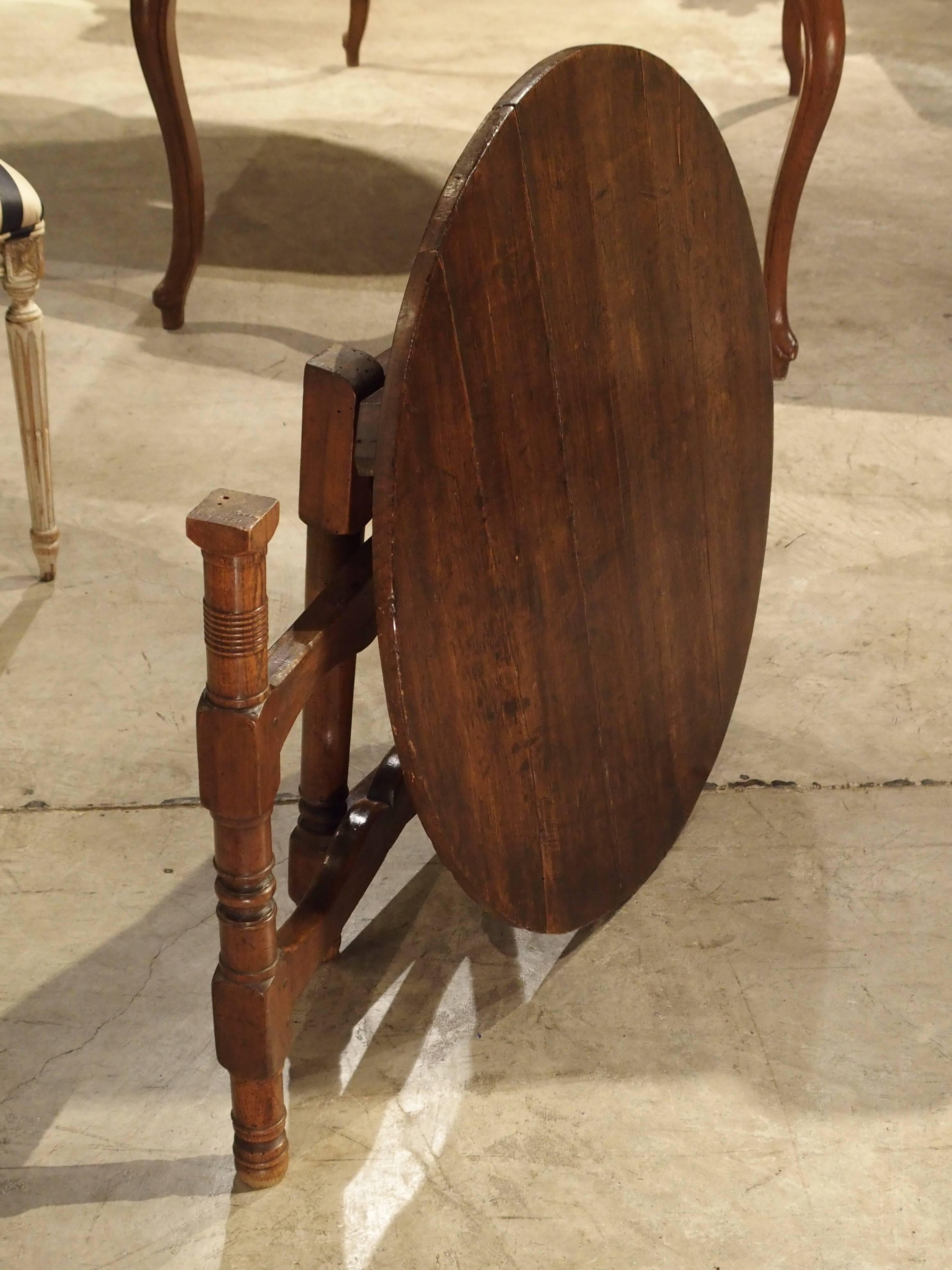 This versatile side or end table is also a tilt-top table from France. It has been constructed of prime French walnut wood, which was so valuable to Louis XV, that he would not allow it to be exported during his reign. The front leg moves to one