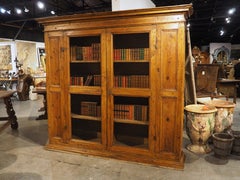 A Circa 1800 Tuscan Pine Bookcase with Wire Panels