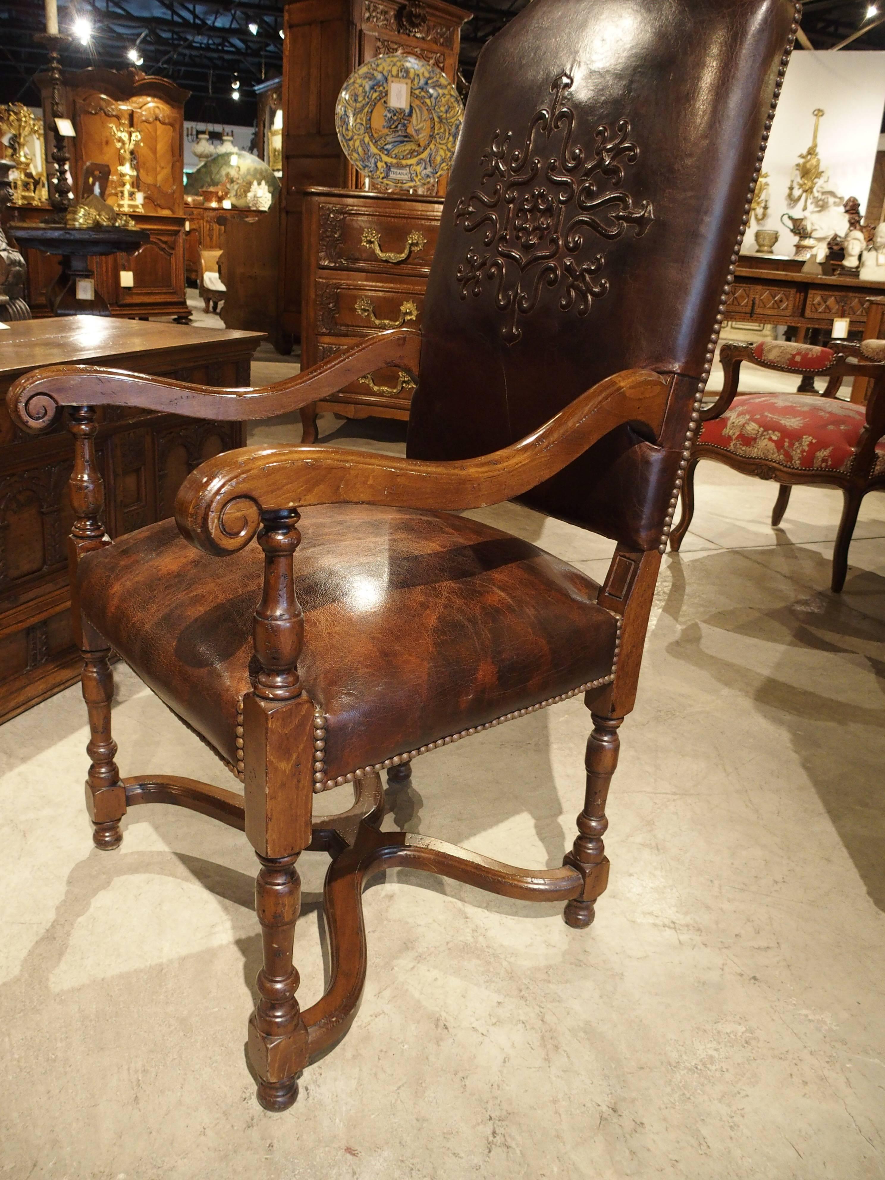 Carved Embossed Leather Walnut Wood Armchair from France