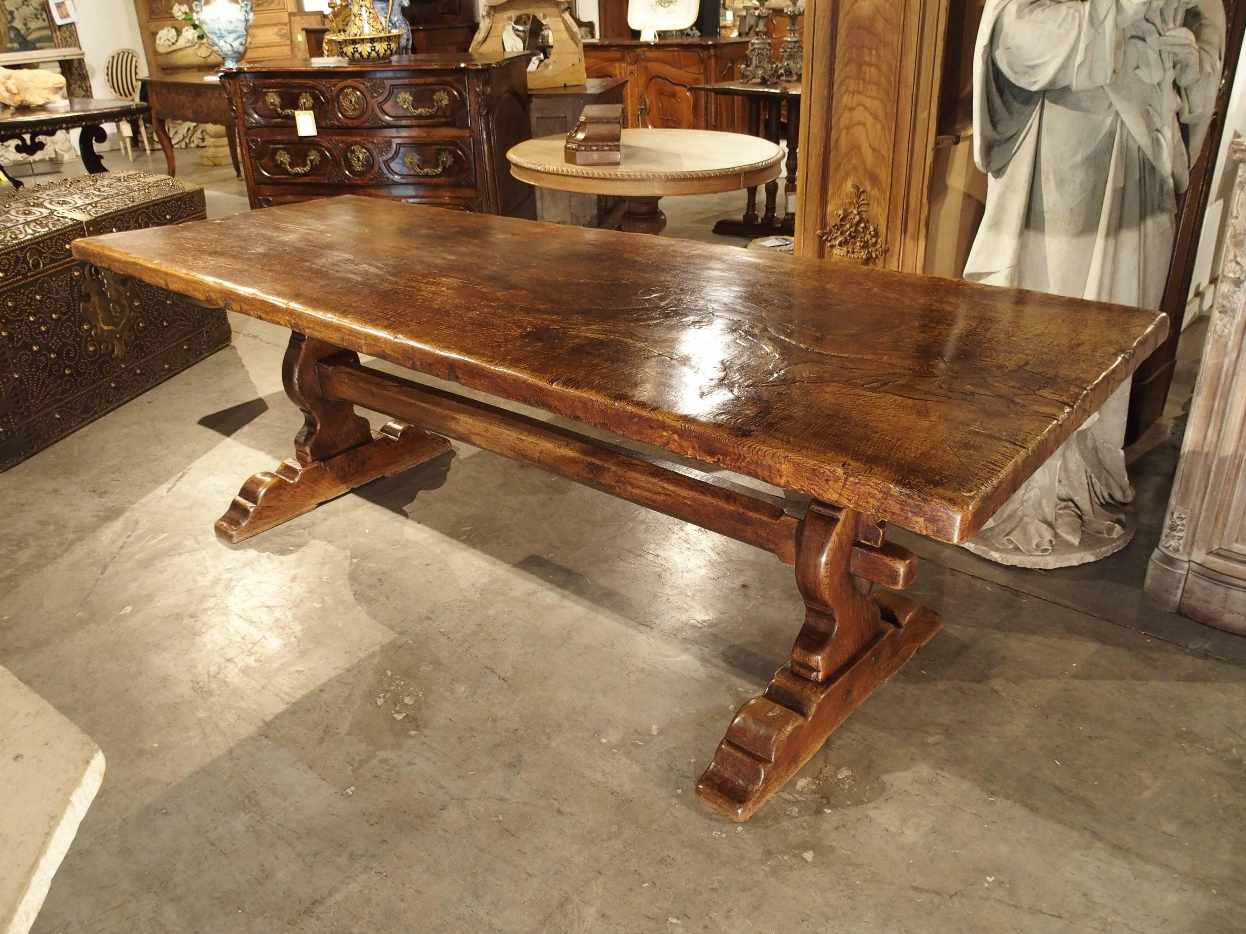 The top of this beautiful table is a single piece of solid French oak! There is a magnificent burl at one end of the top which just adds to its beauty and value. It has been constructed sometime in the late 1800s and possibly older. In the