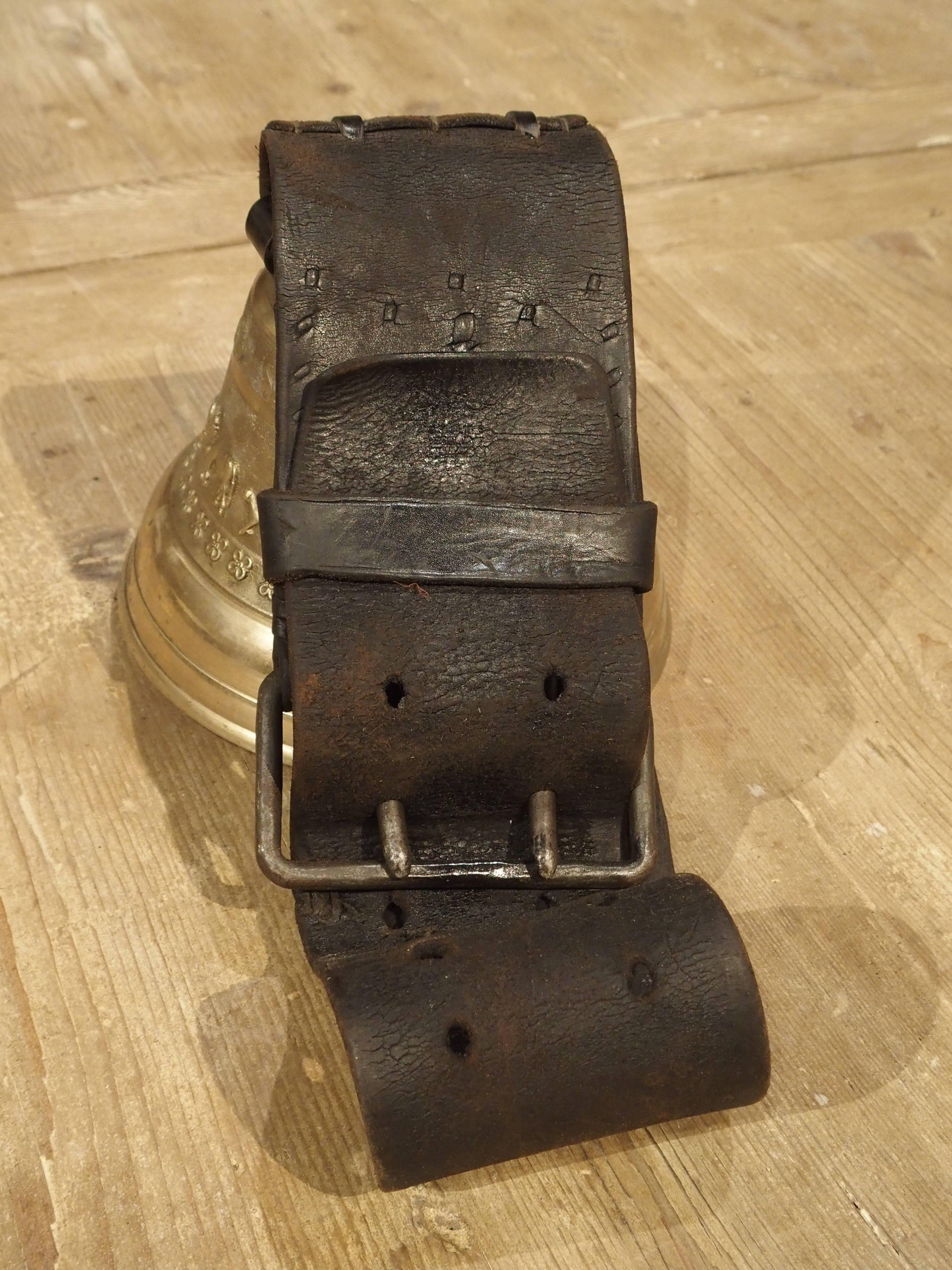 This antique bronze Swiss cowbell has a leather strap for securing the bell around the animal’s neck. It was used to track animals within the herd. The cowbell was not only used on cows, but also various animals within other herds including cows,