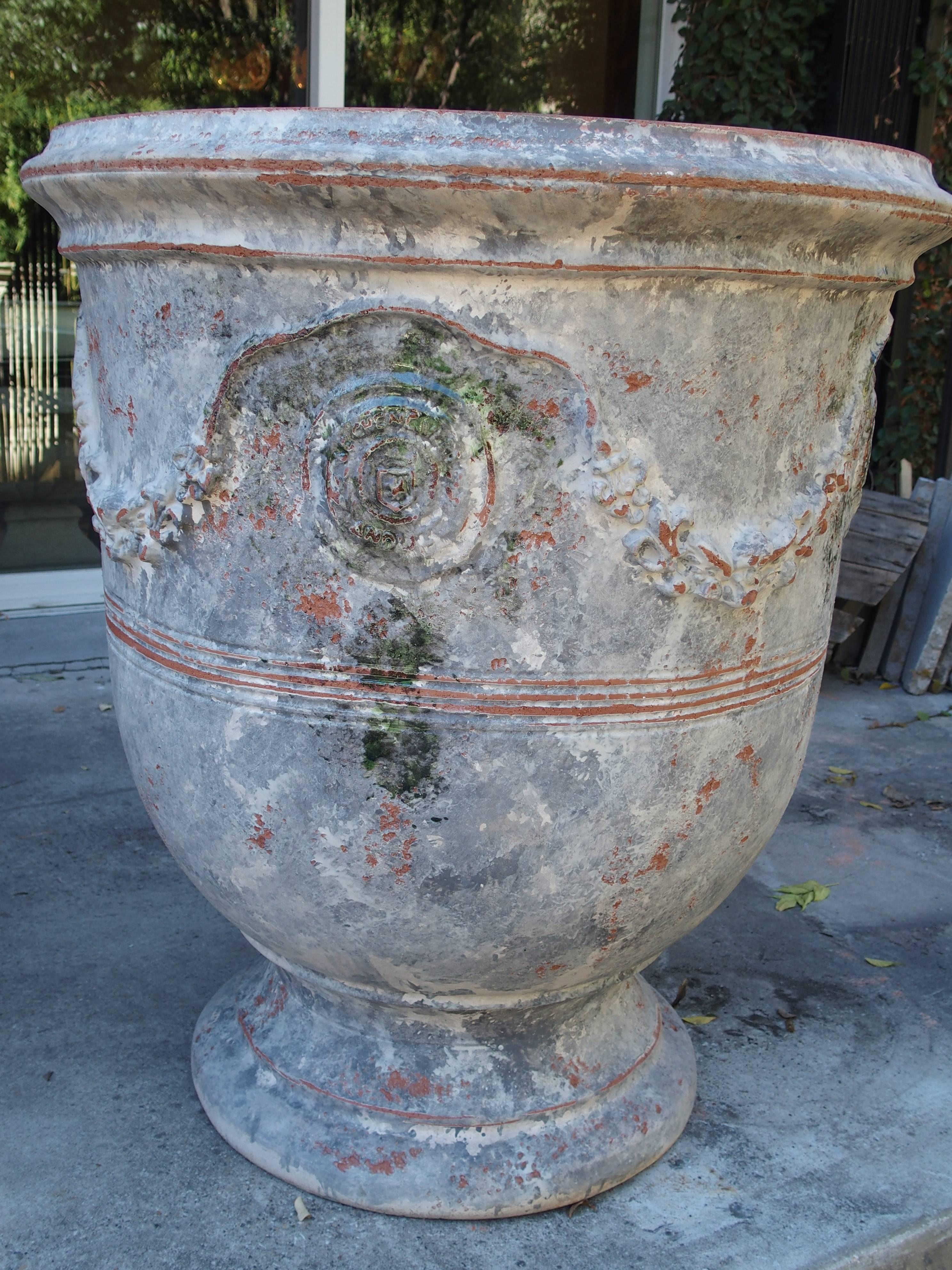 These wonderful painted Anduze pots have been finished with a matte white and blue-grey paint and purposely distressed. Originally, in the 17th century, these types of large pots were used for planting lemon and orange trees. Today, they can be used