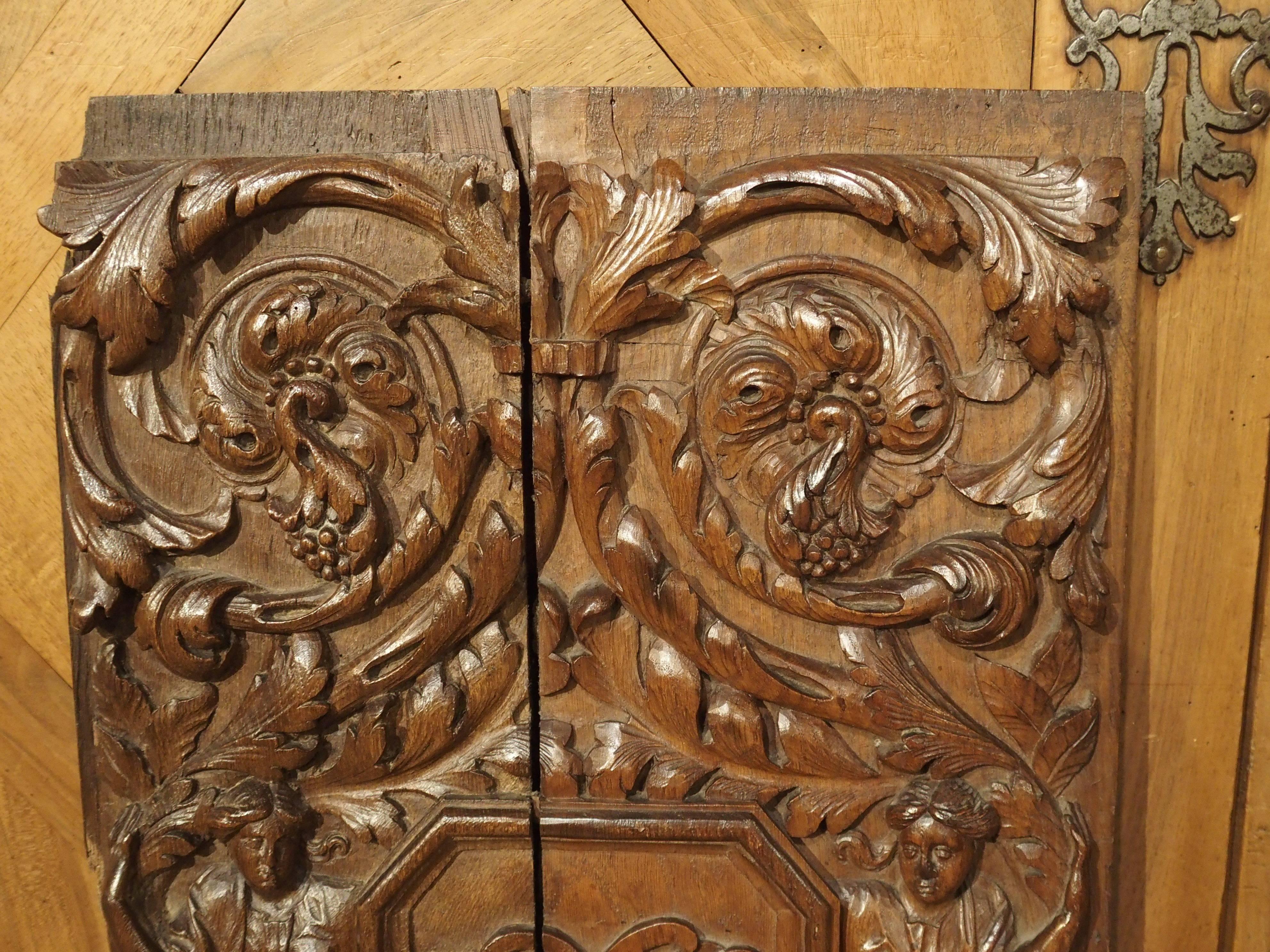 These phenomenal hand-carved architectural panels date to the 1600s. They are completely carved in relief, and they are in the Renaissance style with motifs of scrolling rinceaux at the top and bottom. In the middle of each is a canted panel with a