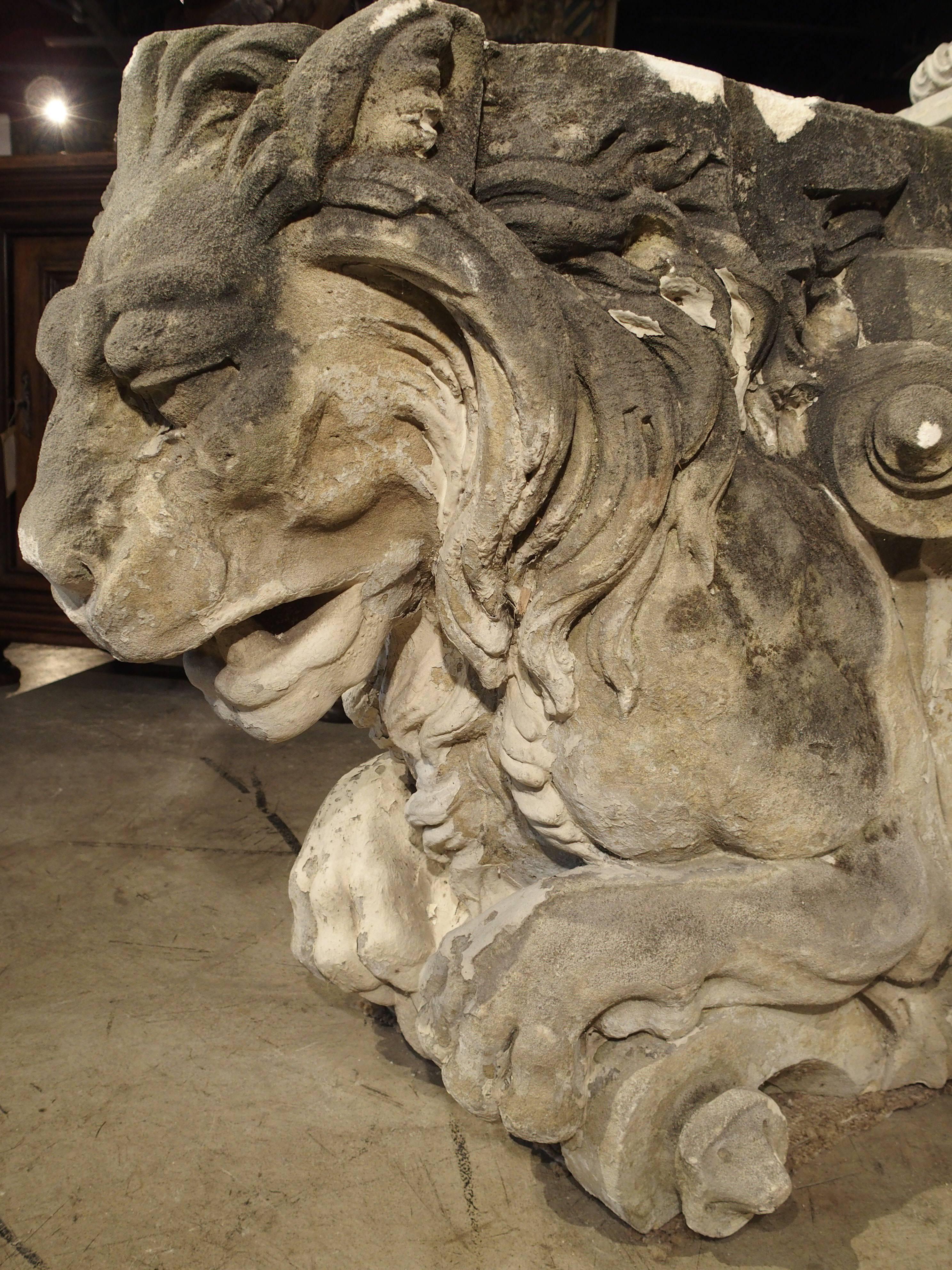 These large and phenomenal antique French stone lions were removed from the front of a building at some point in their history. They were likely attached to the front of a Chateau where they stood guard, representing strength, nobility, and bravery.