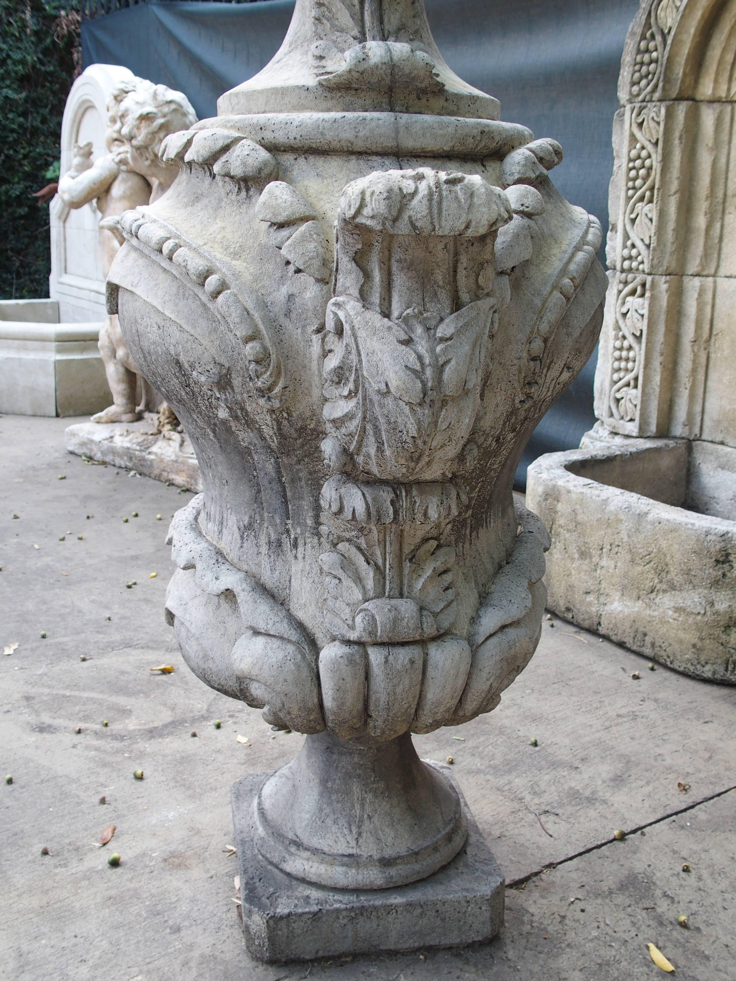 This is a pair of unique garden ornaments in the form of French Cassolettes. Cassolettes were traditionally French made in the 17th-19th century out of marbles and bronze. This pair was made from crushed stones and cement and has been darkened with