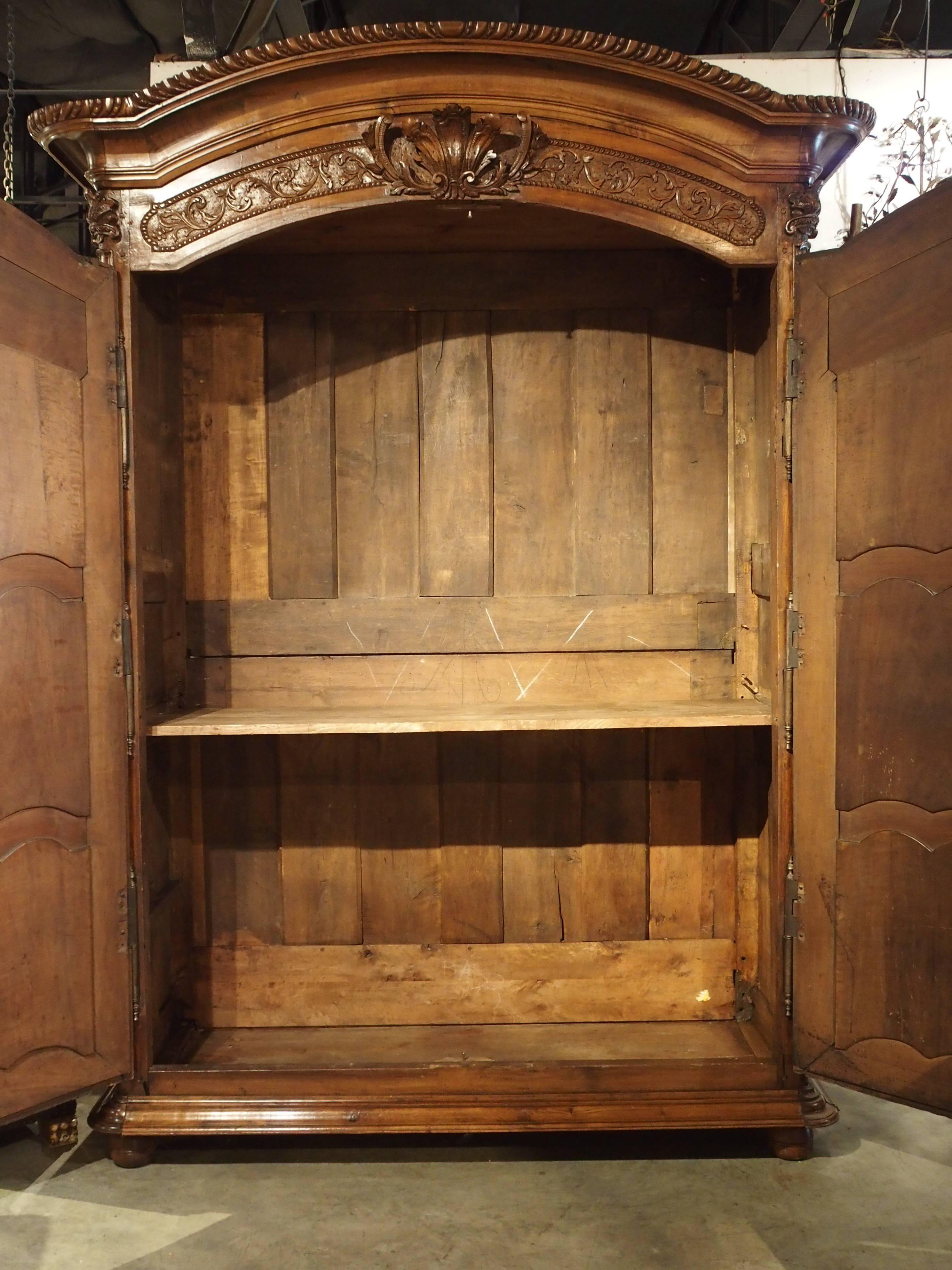 The 'Cross of Saint Louis', carved into the front panels of this armoire represents L'Ordre de Saint Louis. This was an honorary recognition devised by King Louis XIV in 1693, and the first of its kind that gave special honors for military officers.