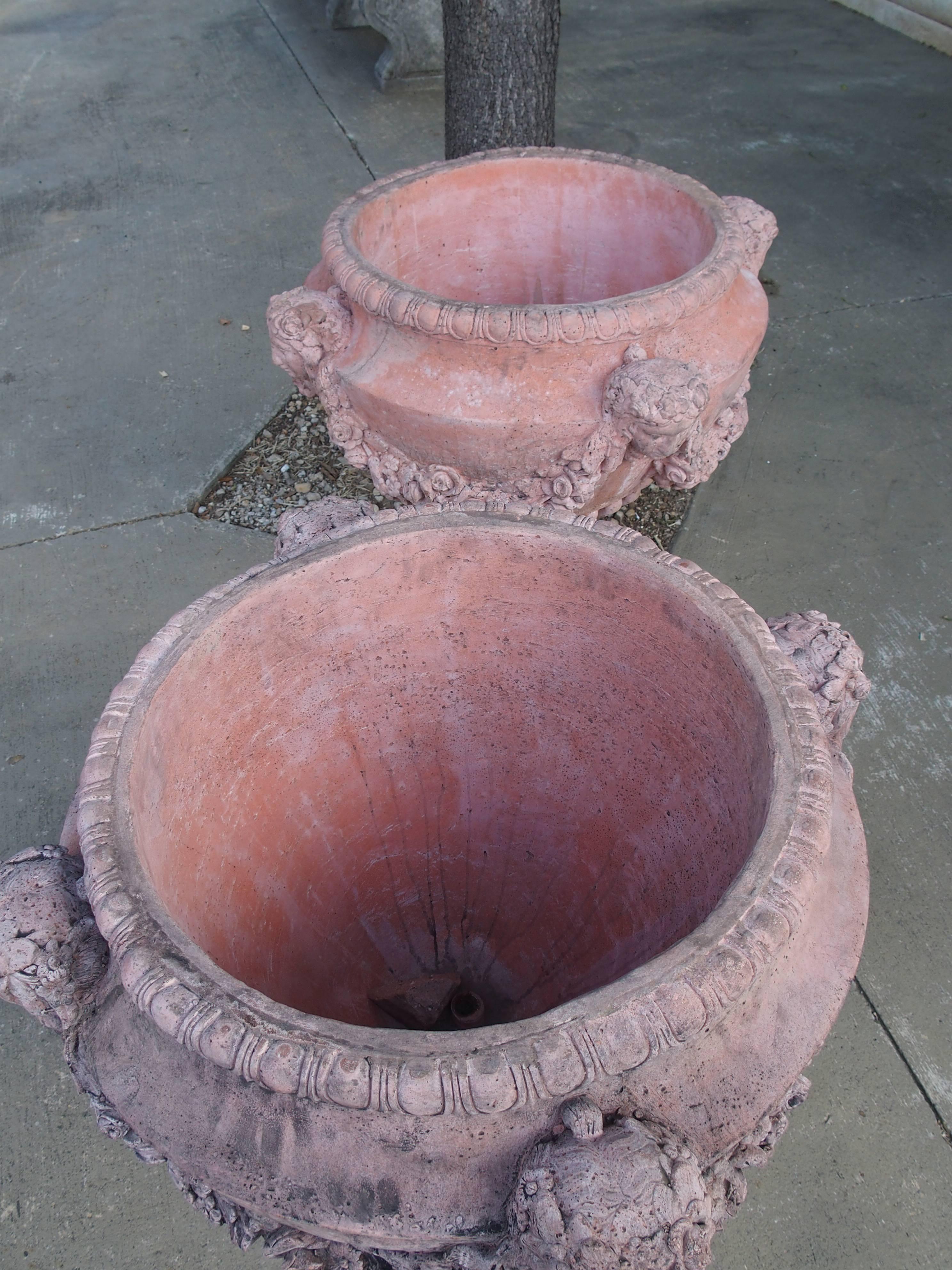 Pair of French Terra Cotta Colored Cast Stone Urns In Good Condition In Dallas, TX