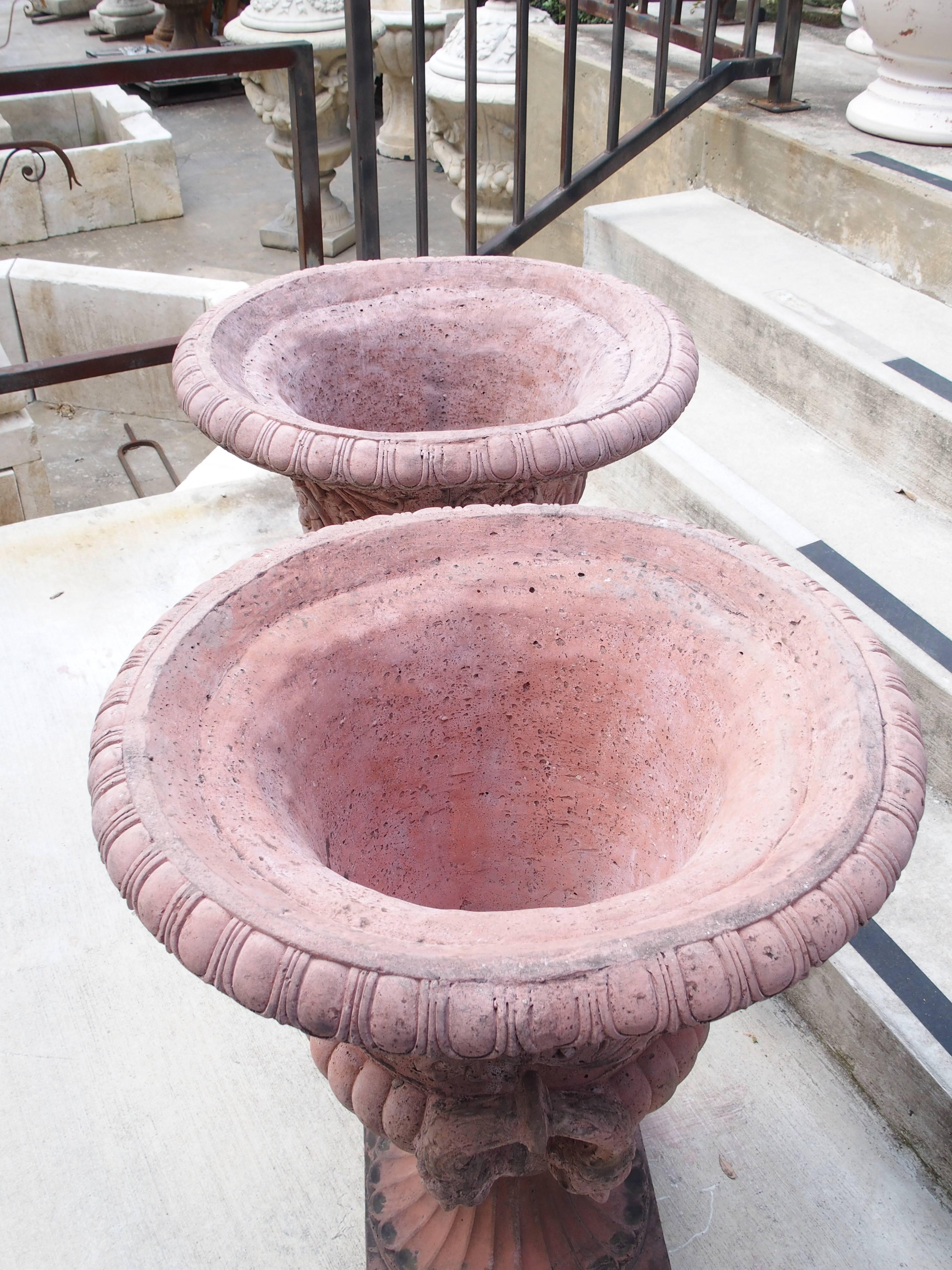 Pair of French Terra Cotta Colored Cast Stone Medici Urns In Good Condition In Dallas, TX
