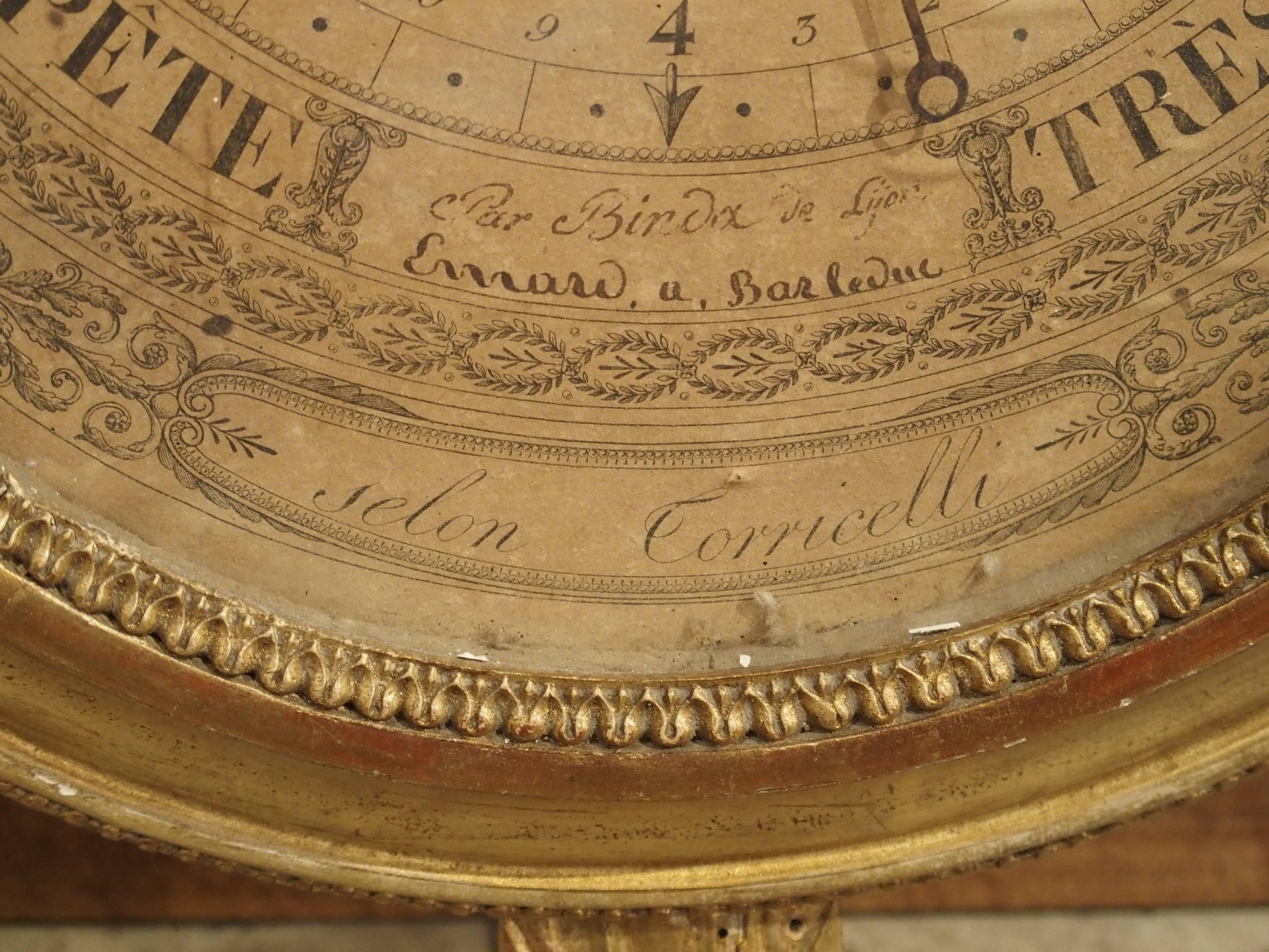 This rare barometer is known as a Selon de Torricelli and dates to the late 18th century. This name refers to the mechanism invented by Italian physicist Evangelista Torricelli over 100 years earlier. It is giltwood with motifs of the laurel leaf