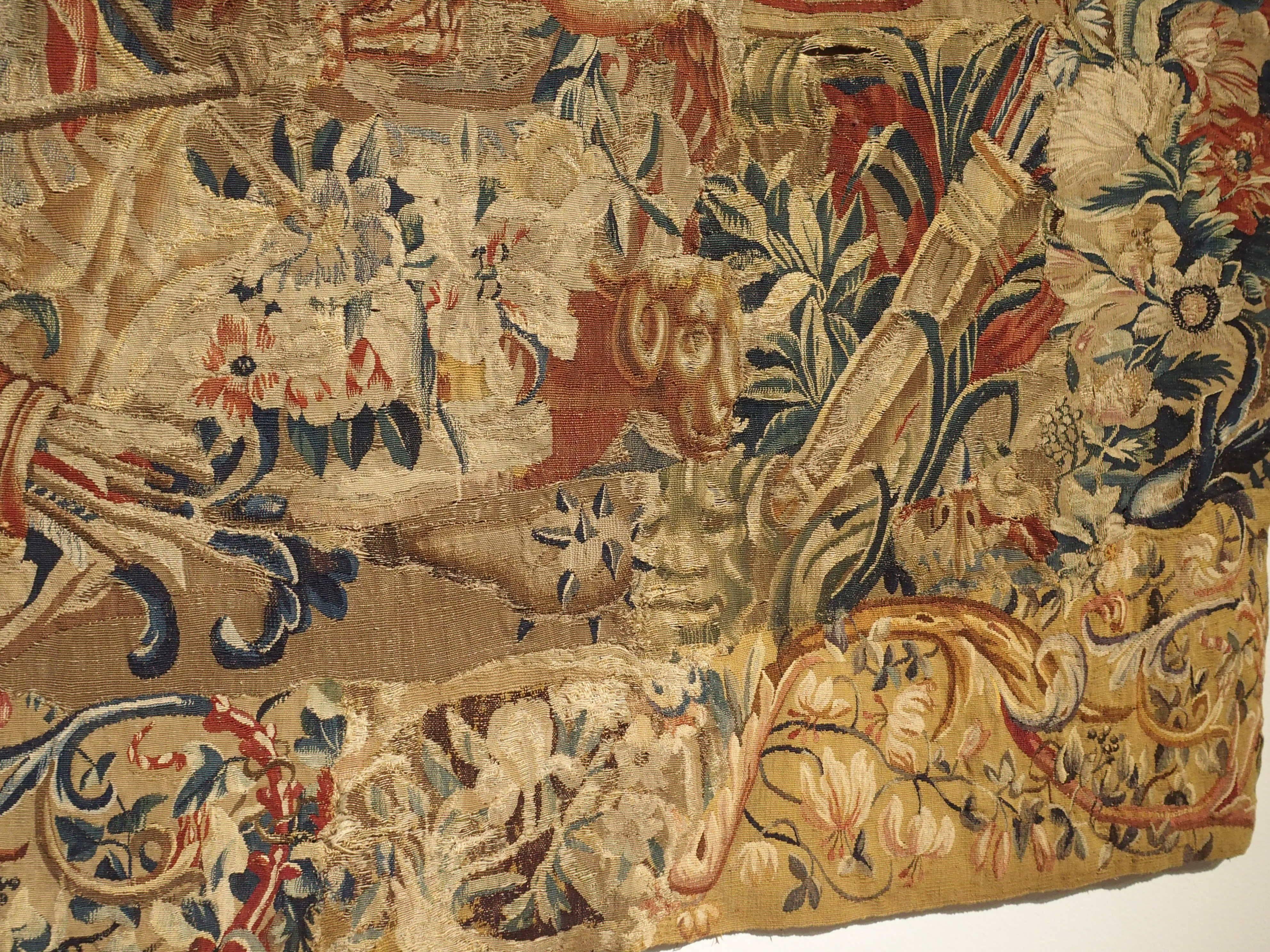 This is a large, horizontal fragment of a late 17th century Beauvais tapestry. Beauvais tapestry manufacture was one of the most well-known tapestry workshops in France. Beauvais was a private enterprise which made glorious tapestries at the special