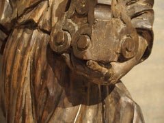 Carved 17th Century French Statue of an Angel Holding a Candlestick
