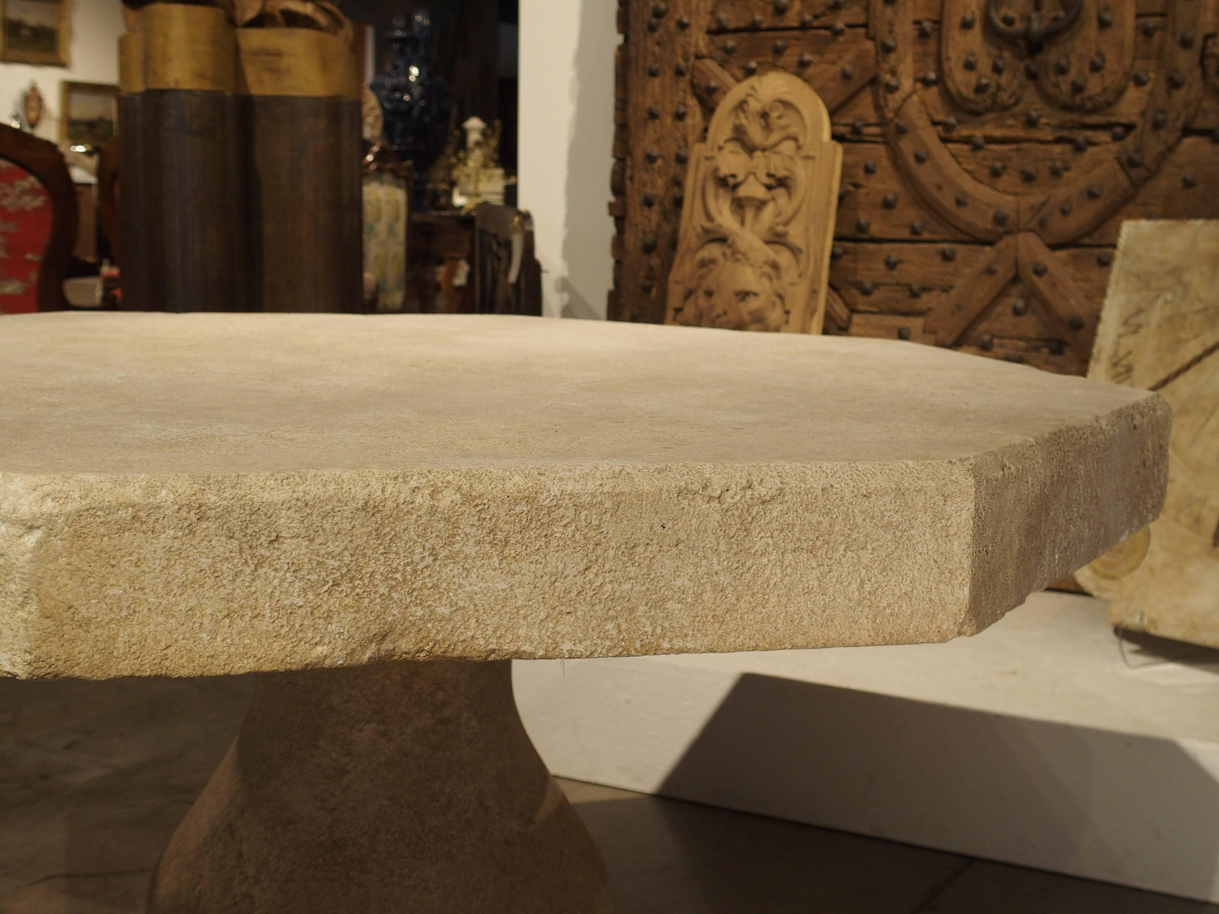 This versatile, hand carved, octogonal stone table from France can be used outside as well as inside. It is made of French estaillade limestone, which has been used for centuries in the creation of outdoor pieces. When the limestone is quarried, it