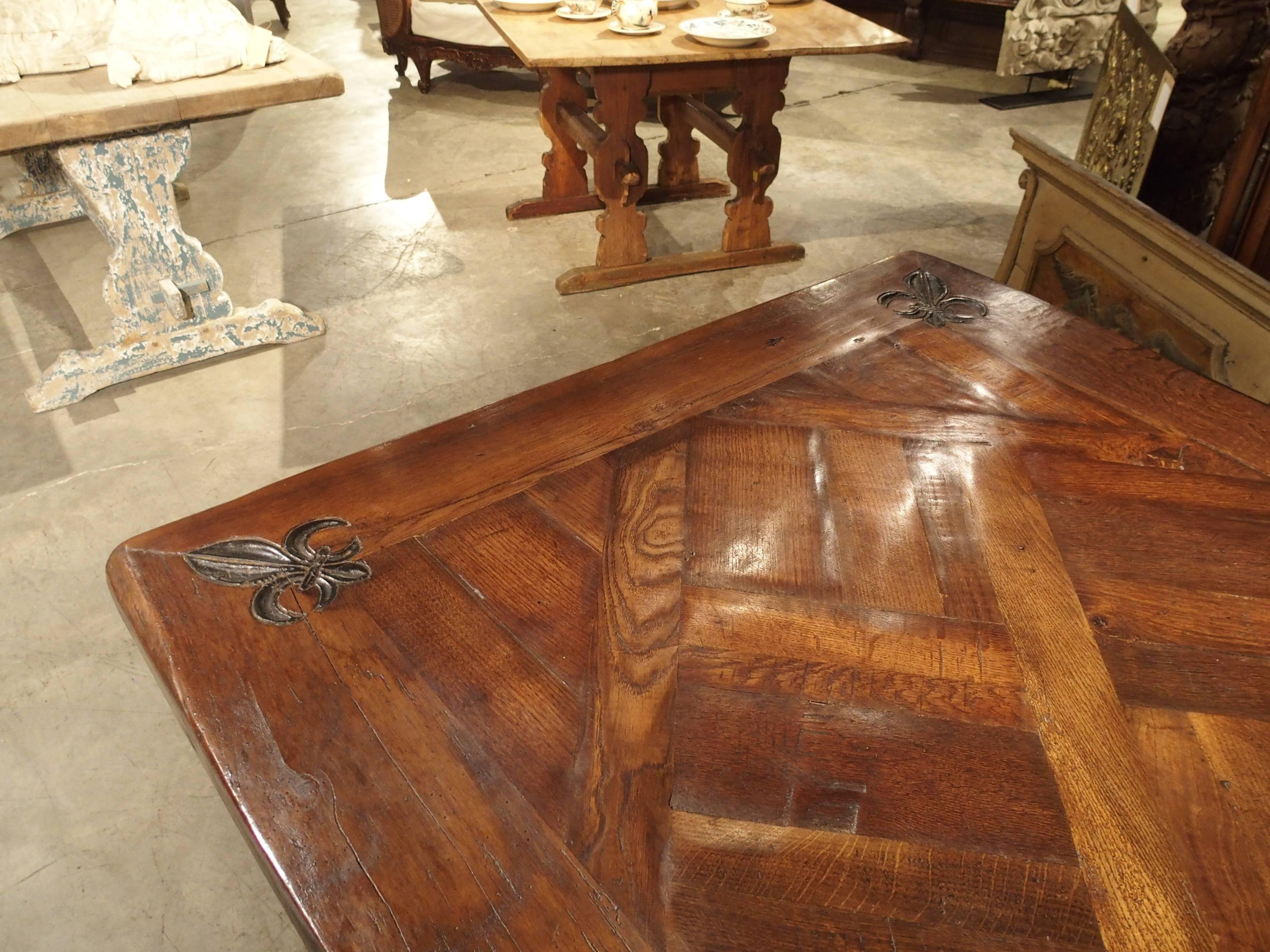 Hand-Carved Large French Oak Dining Table with Parquet Top and Fleur De Lys Corners